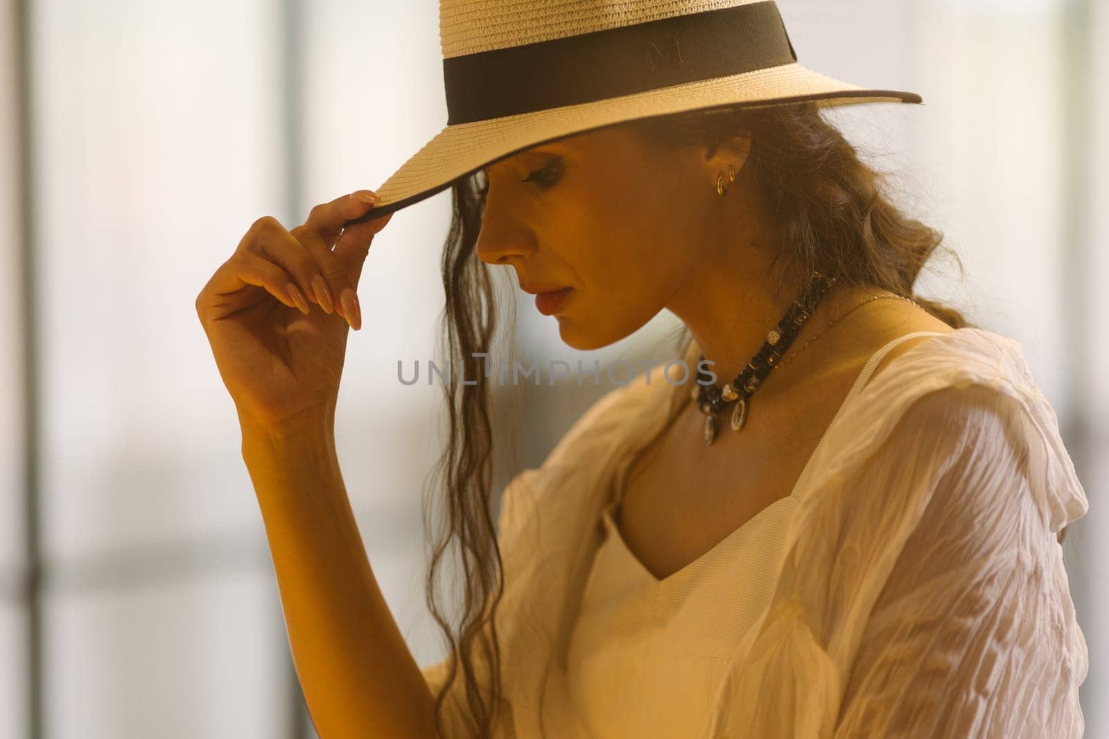 Beautiful tender woman in white dress posing. Beauty, fashion. Haircare. Cosmetics. by sarymsakov