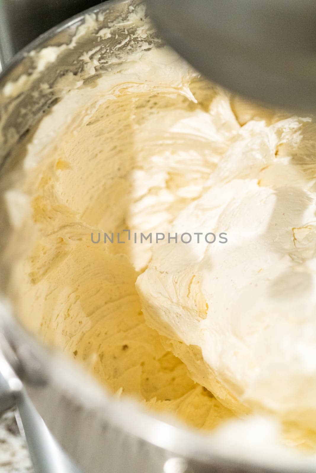 Creamy Buttercream Frosting Whipped in Stand Mixer Bowl by arinahabich