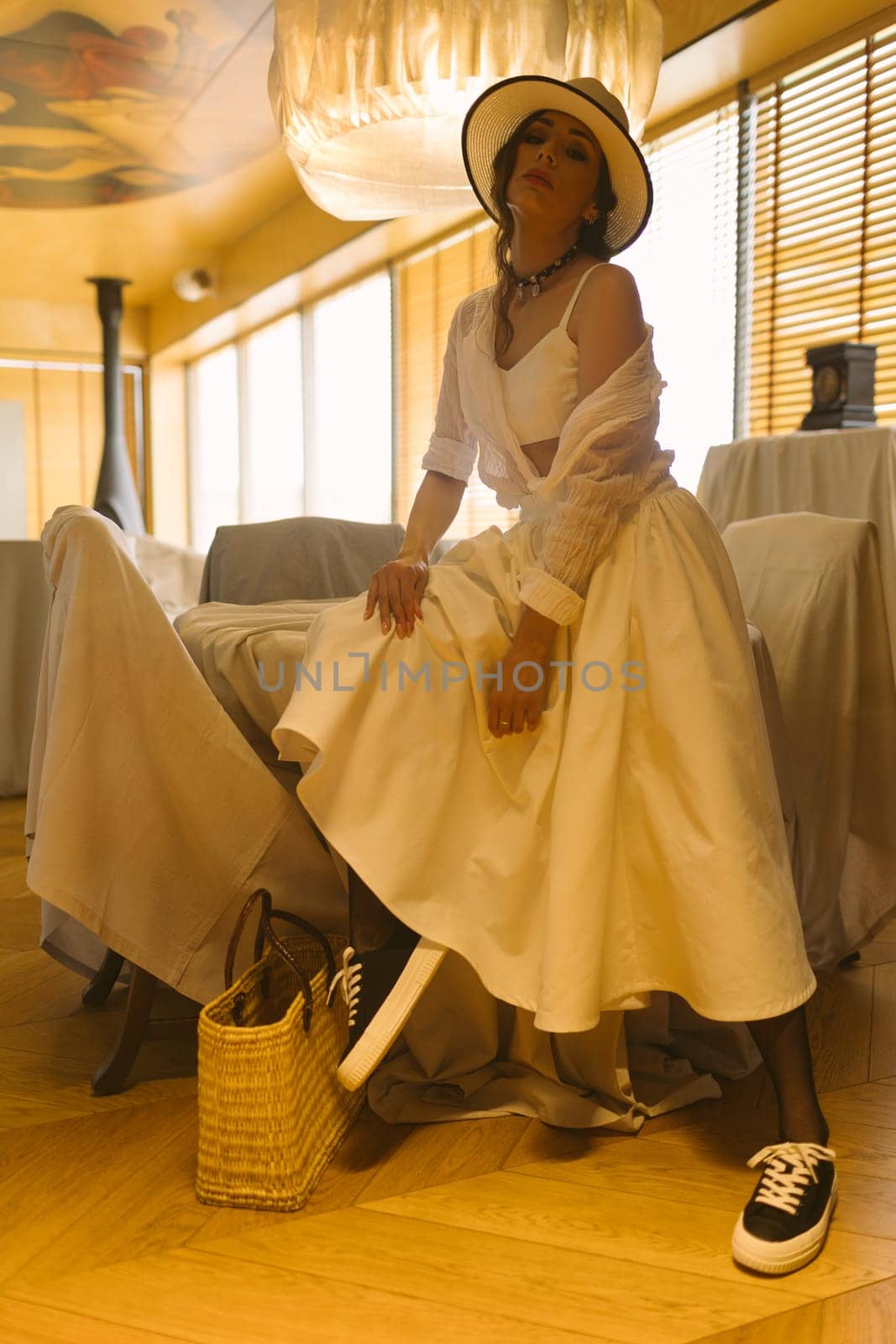 Beautiful tender woman in white dress posing. Beauty, fashion. Haircare. Cosmetics