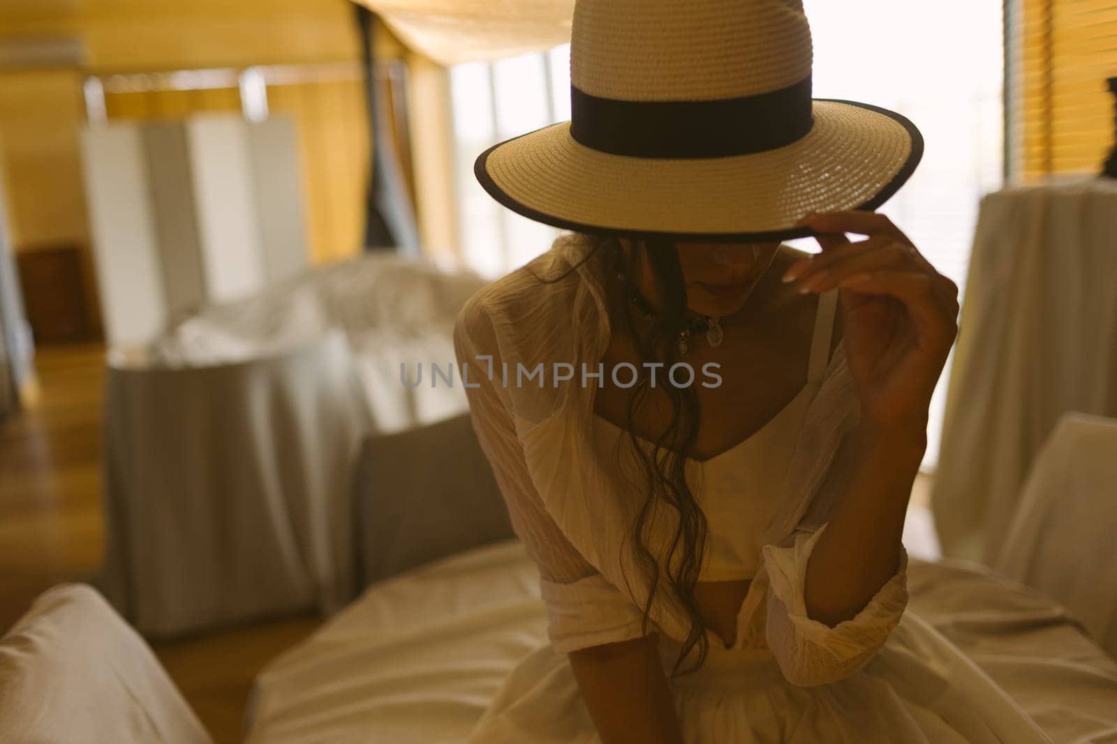 Beautiful tender woman in white dress posing. Beauty, fashion. Haircare. Cosmetics. by sarymsakov