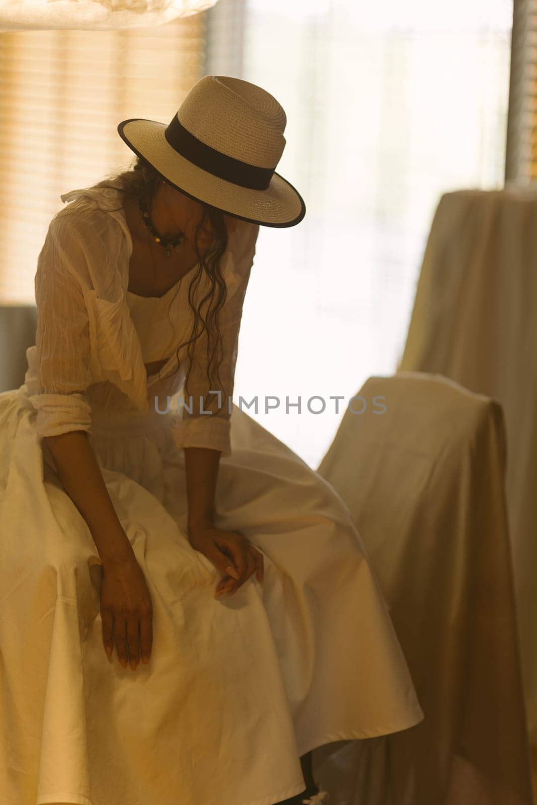 Beautiful tender woman in white dress posing. Beauty, fashion. Haircare. Cosmetics. by sarymsakov