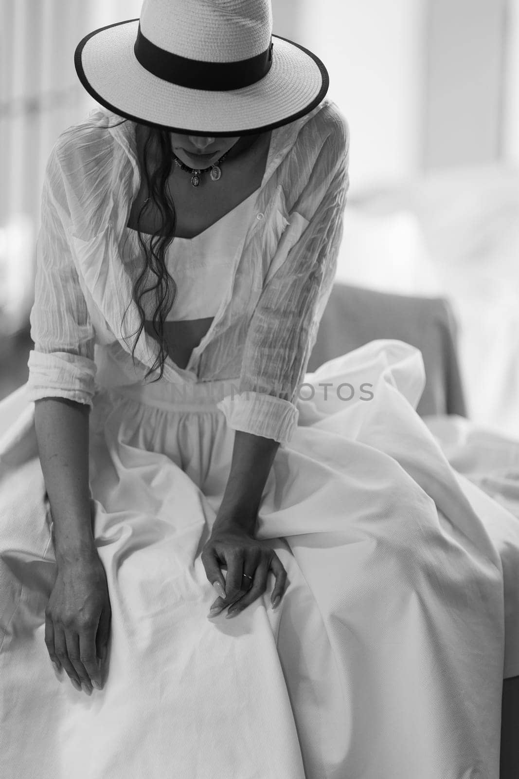 Beautiful tender woman in white dress posing. Beauty, fashion. Haircare. Cosmetics. by sarymsakov
