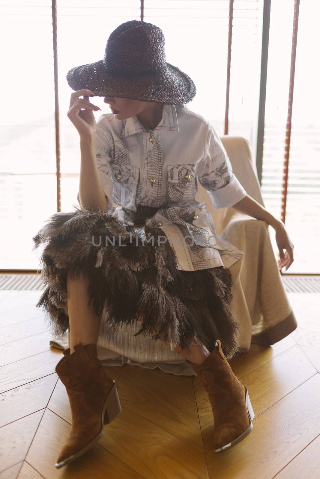 Indoor portrait of a young beautiful fashionable woman wearing stylish accessories. by sarymsakov