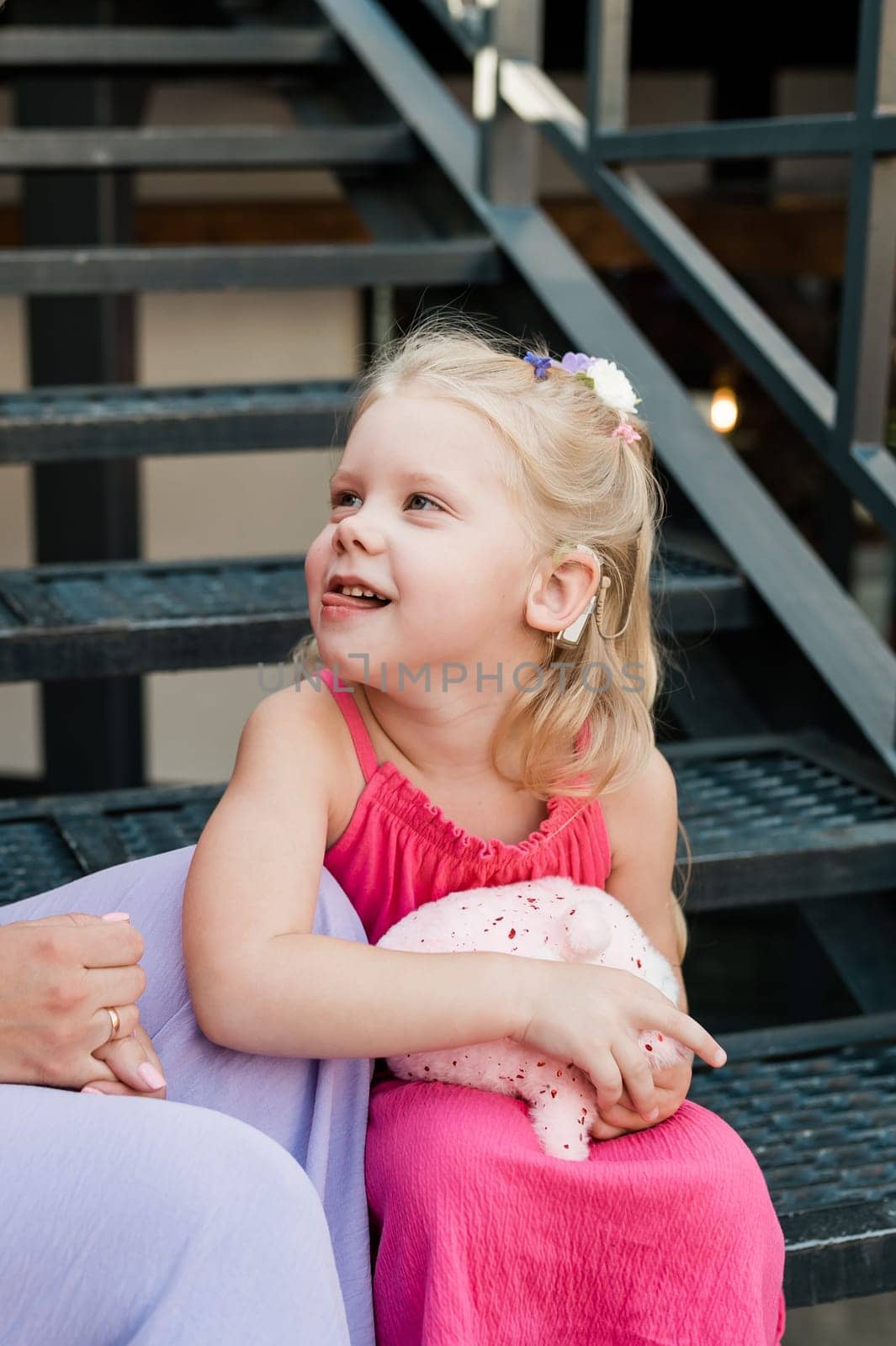 Child head with cochlear implant hearing aid. Hearing aid and medicine innovating technology and diversity concept