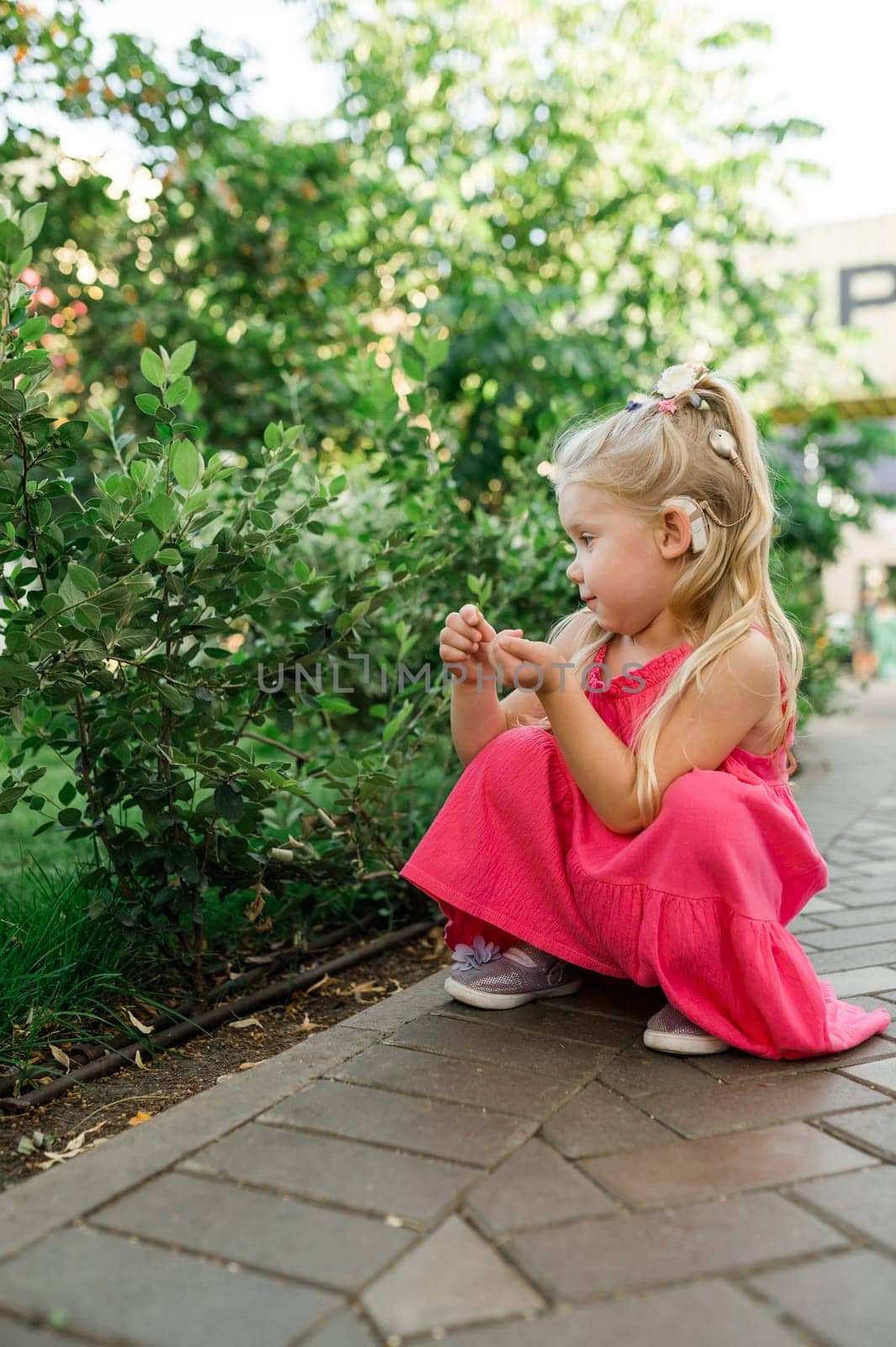 Child head with cochlear implant hearing aid. Hearing aid and medicine innovating technology and diversity concept