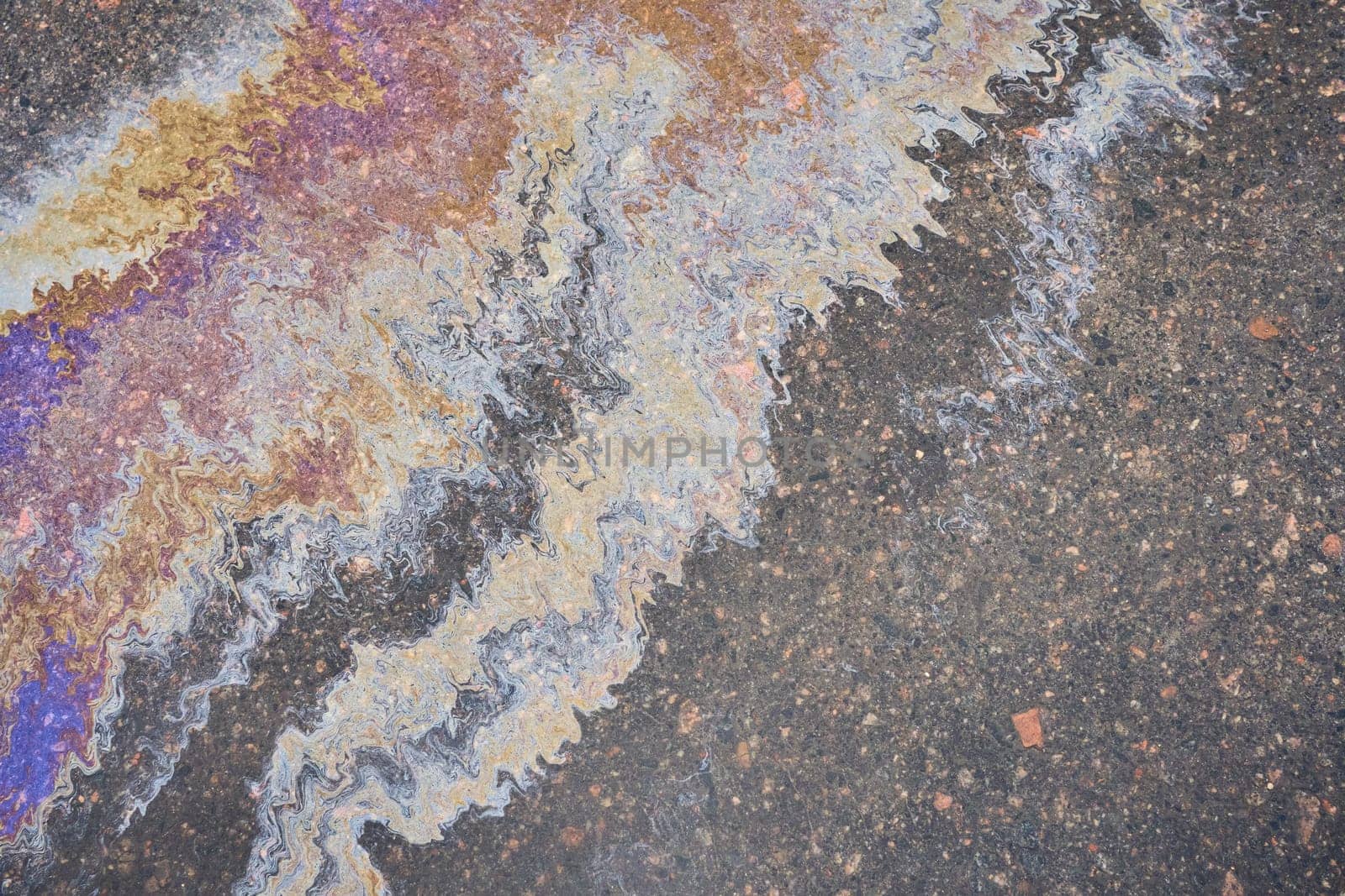 Oil Splotch on Asphalt, Colorful Gasoline Fuel Patterns on Road as Texture or Background by AliaksandrFilimonau