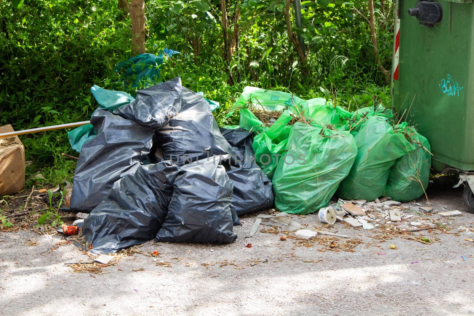 Green and Black Trash Bag Piles: Waste Management Scene by DakotaBOldeman