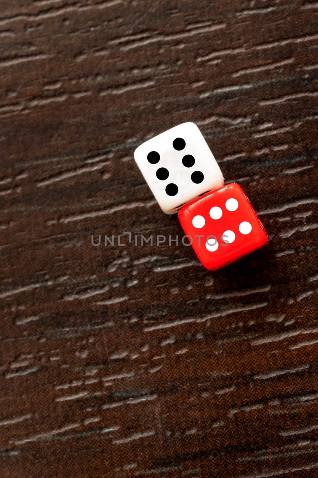 A pair of dice showing a double six on a table by EdVal