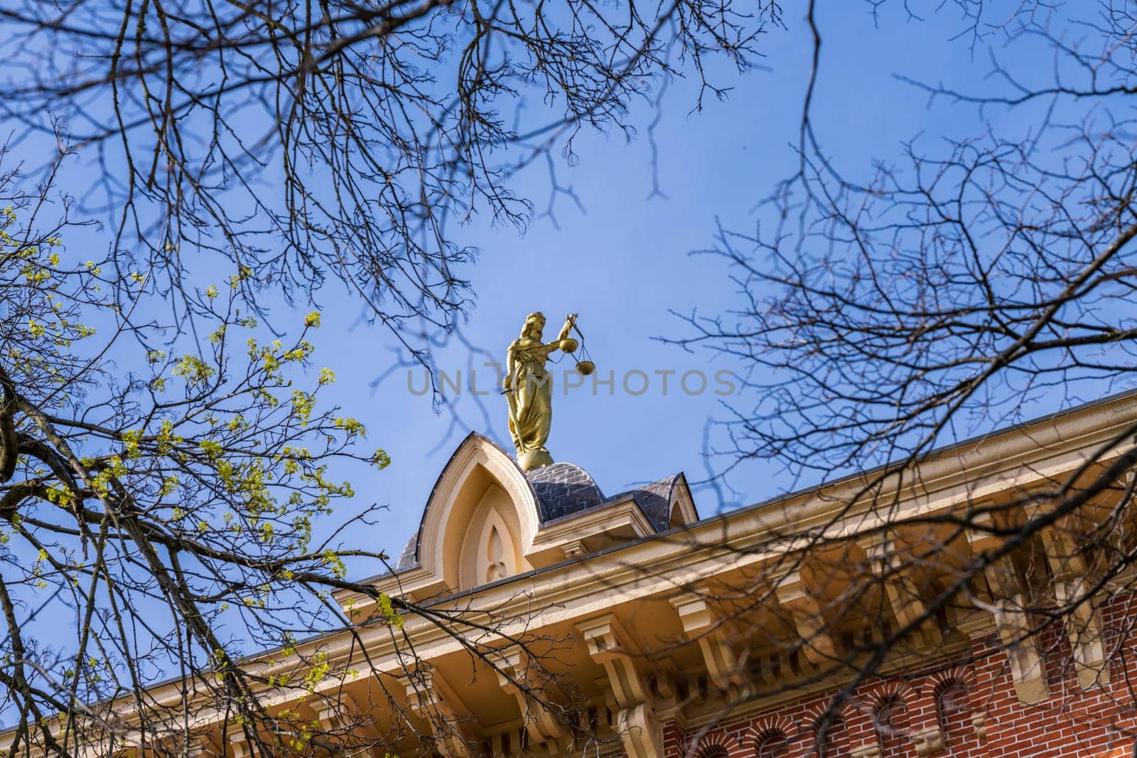 Statue to Lady Justice on the roof of the Delaware County courthouse in Ohio by steheap