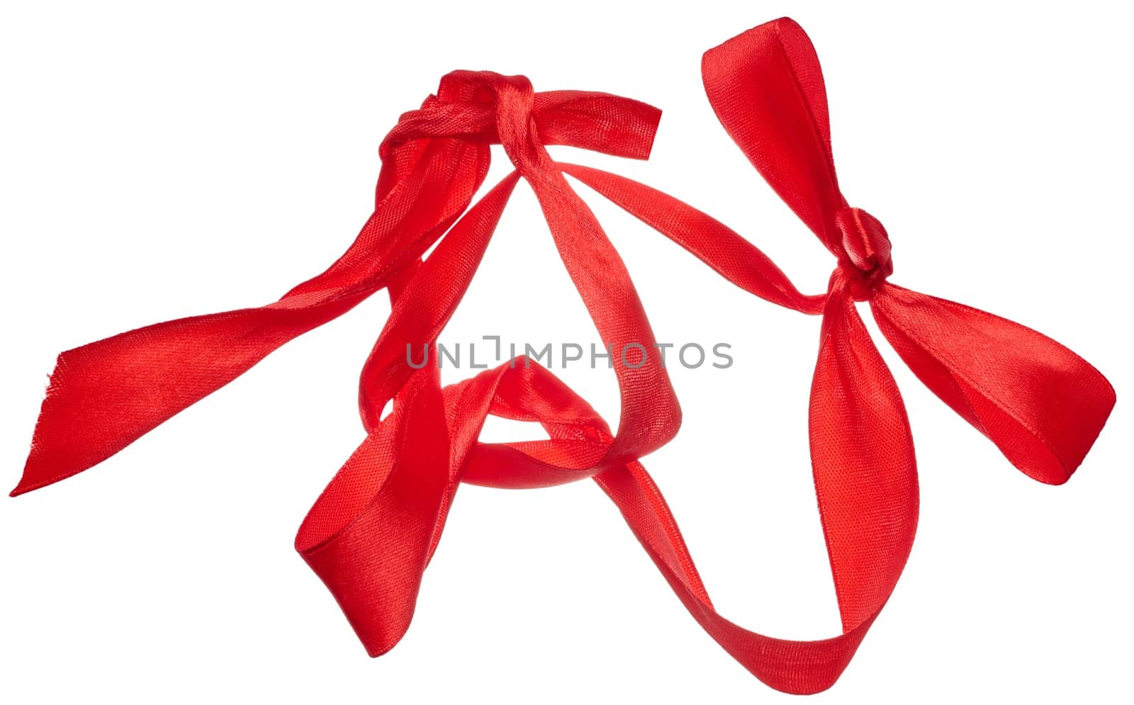 Piece of red satin ribbon on isolated background, top view