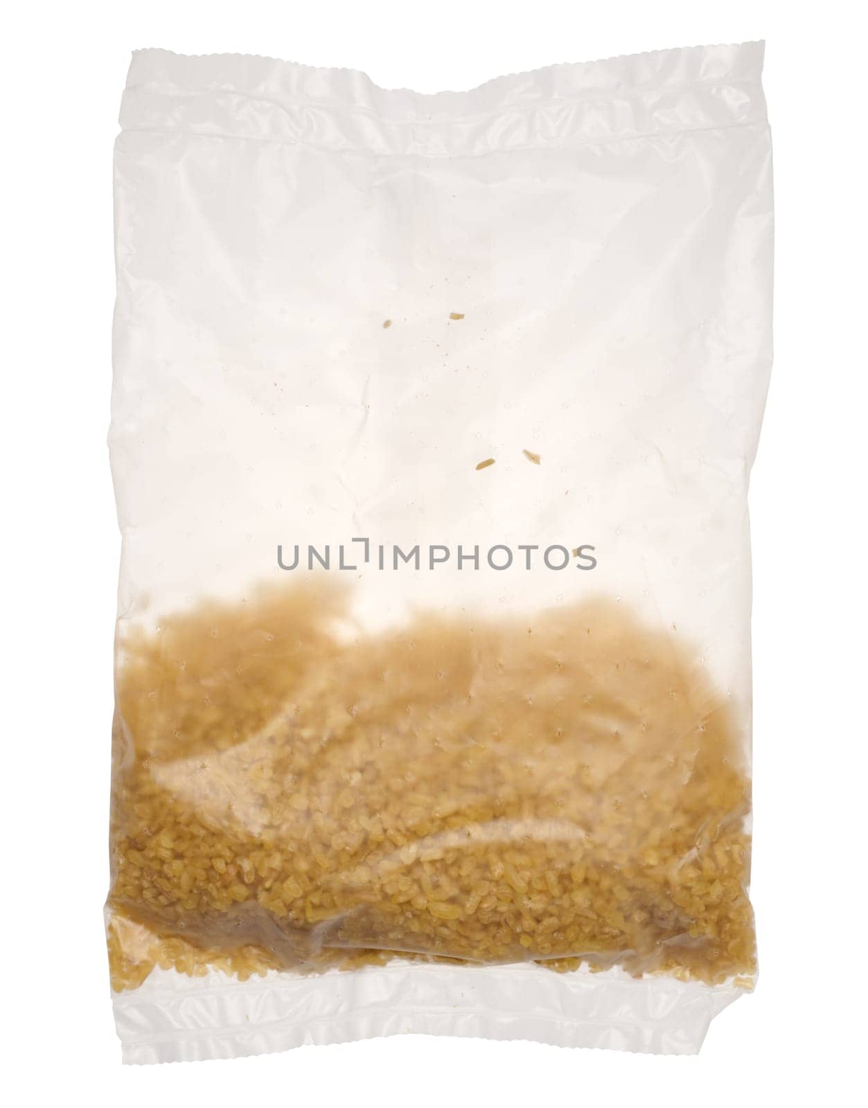 Raw bulgur grains in a cellophane transparent bag on an isolated background by ndanko