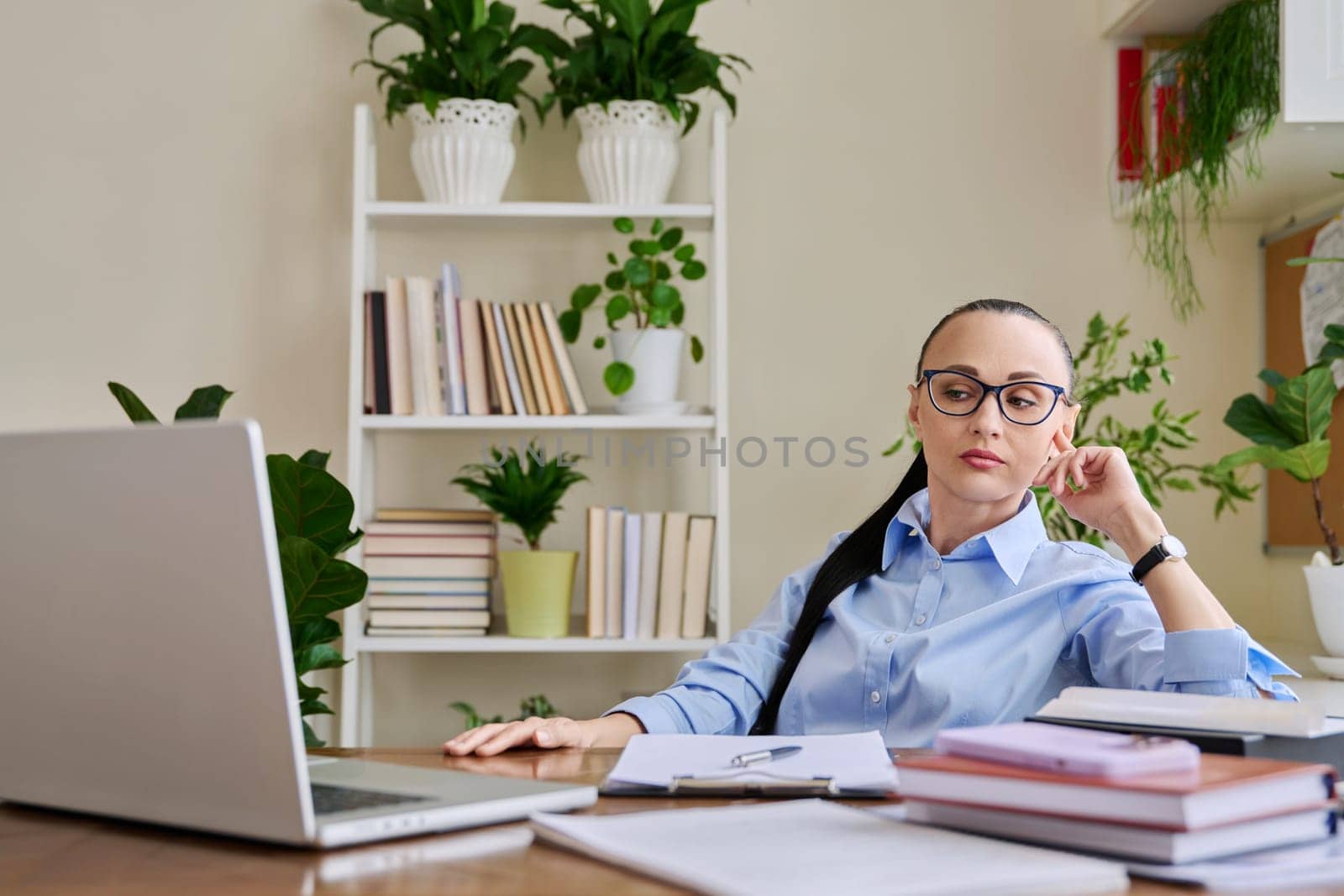 Woman psychologist mental therapist counselor social worker working remotely using computer laptop for online therapy session meeting. Technology psychology psychotherapy counseling support treatment
