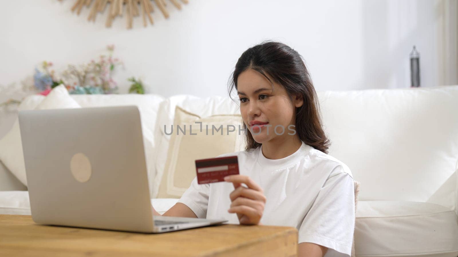 Woman shopping or pay online on internet marketplace browsing for sale items for modern lifestyle and use credit card for online payment from wallet protected by vivancy cyber security software