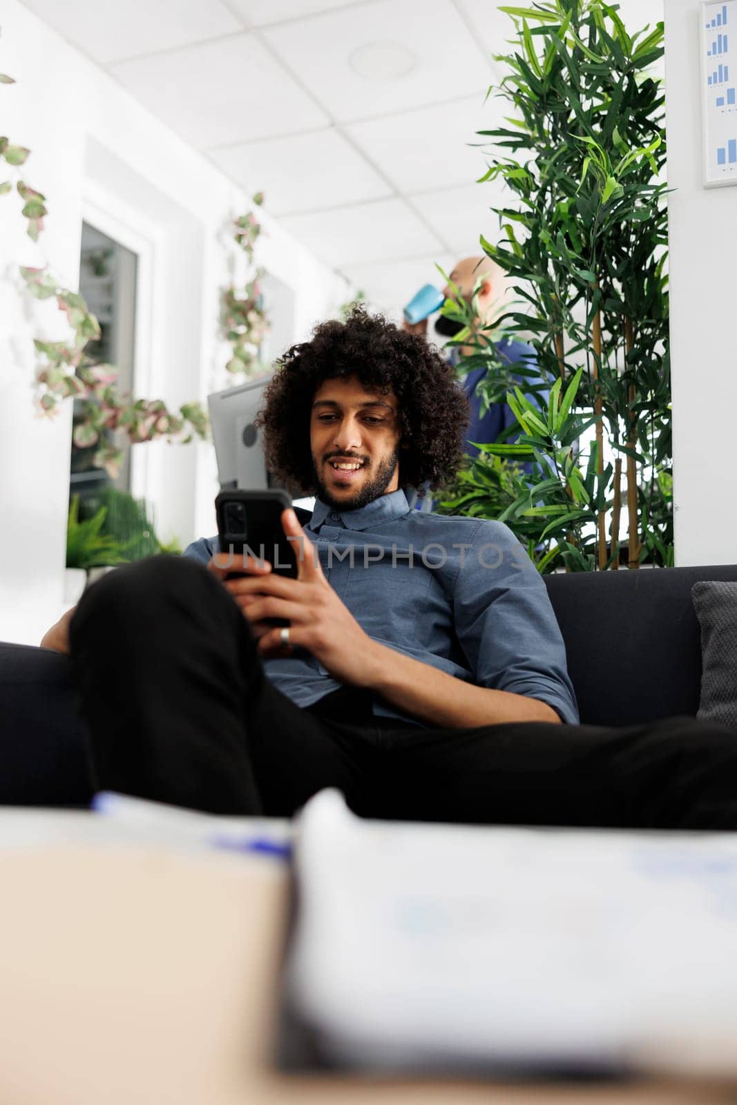 Arab business company worker messaging on smartphone by DCStudio