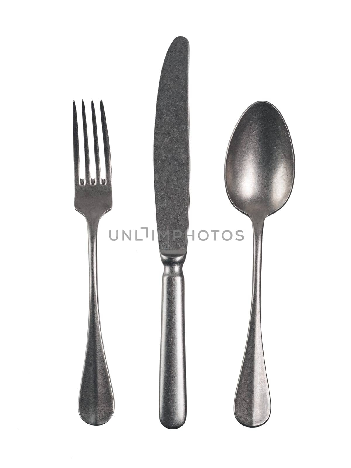 Modern cutlery with antique effect. Cutlery set with Fork, Knife and Spoon Isolated on white with clipping path.