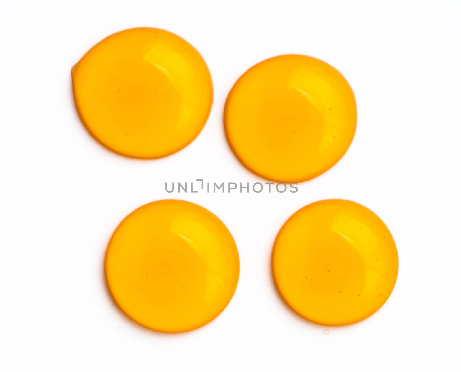 Honey drops. Honey for design elements. Abstract pattern from honey drops. Isolated on white with clipping path. Can use for design or text.