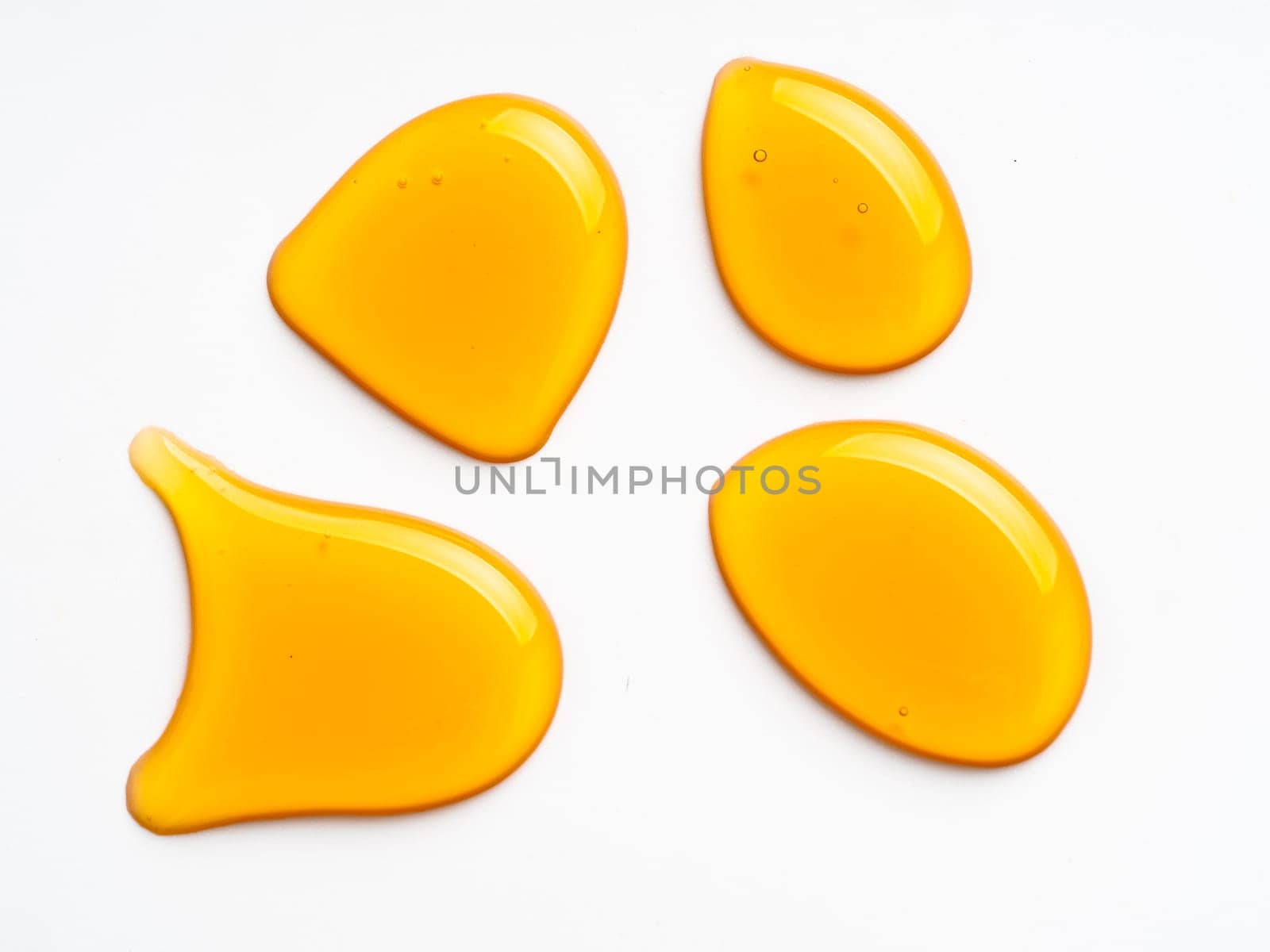 Honey drops. Honey for design elements. Abstract pattern from honey drops. Isolated on white with clipping path. Can use for design or text.