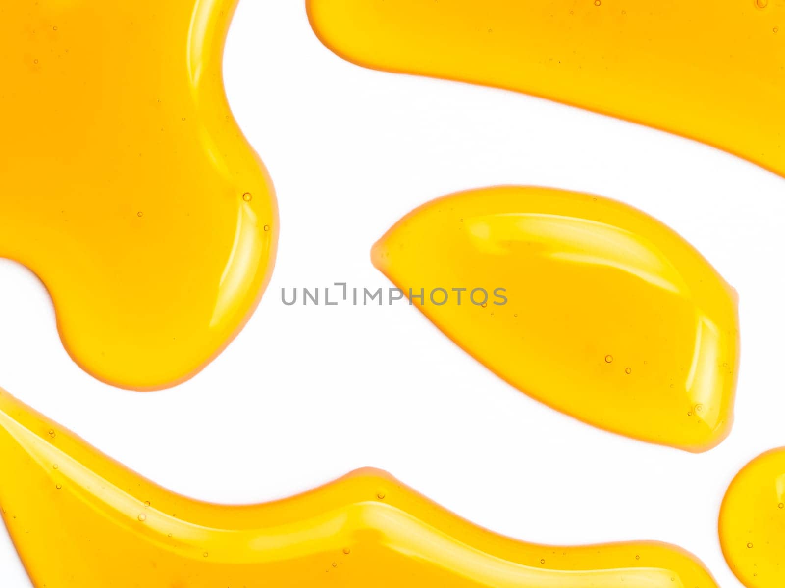 Honey drops. Abstract pattern from honey drops. Isolated on white with clipping path. Can use for design. Copy space for text.