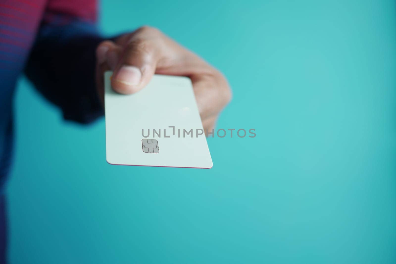 close up of person hand holding credit card.