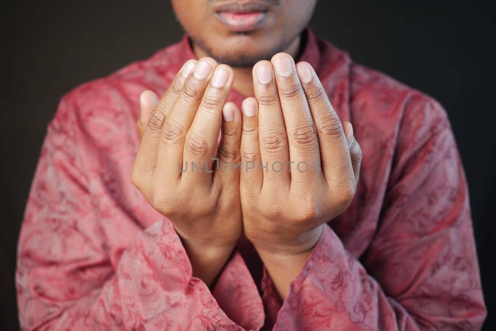 muslim man praying during ramadan .