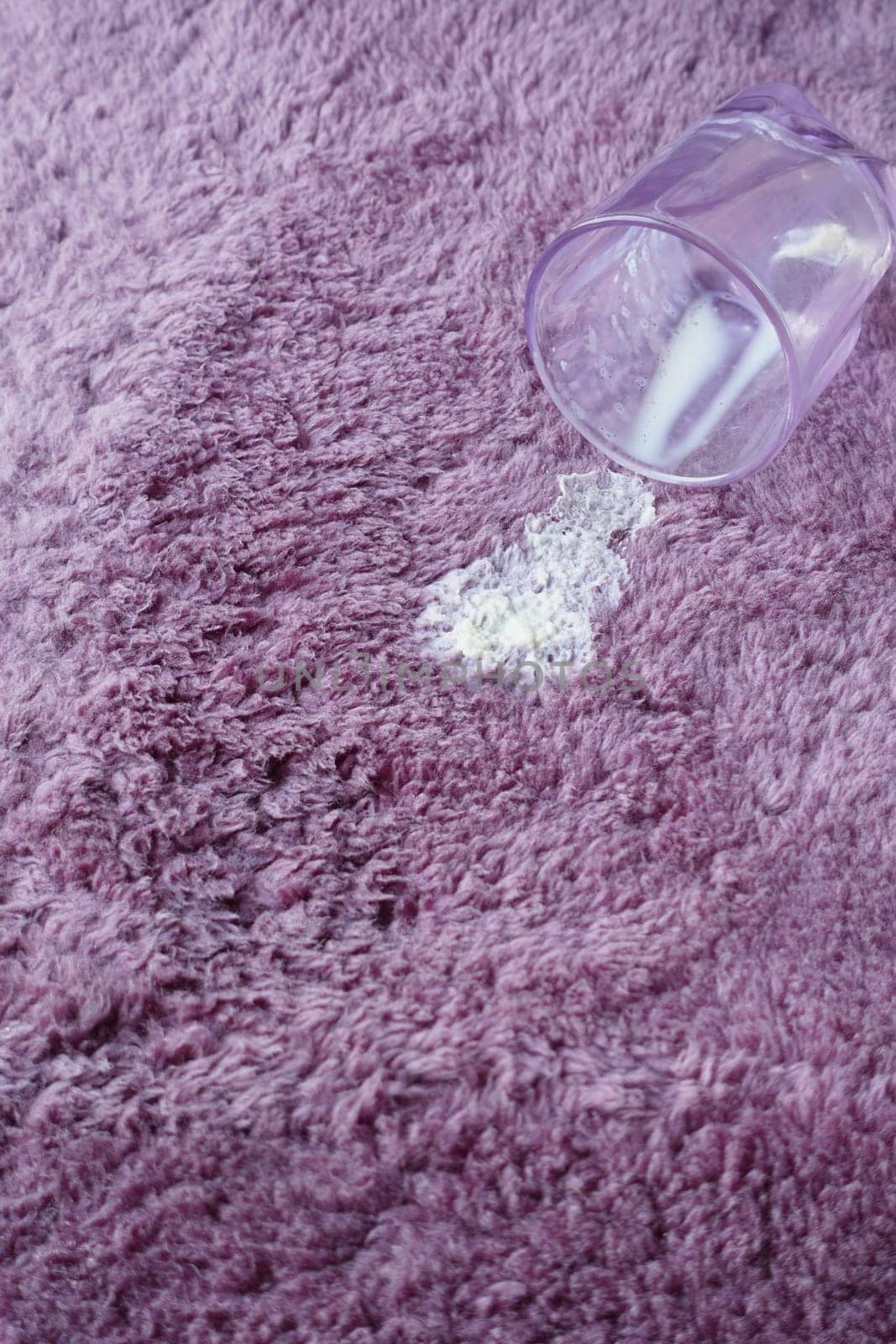 spill milk on a carpet top view