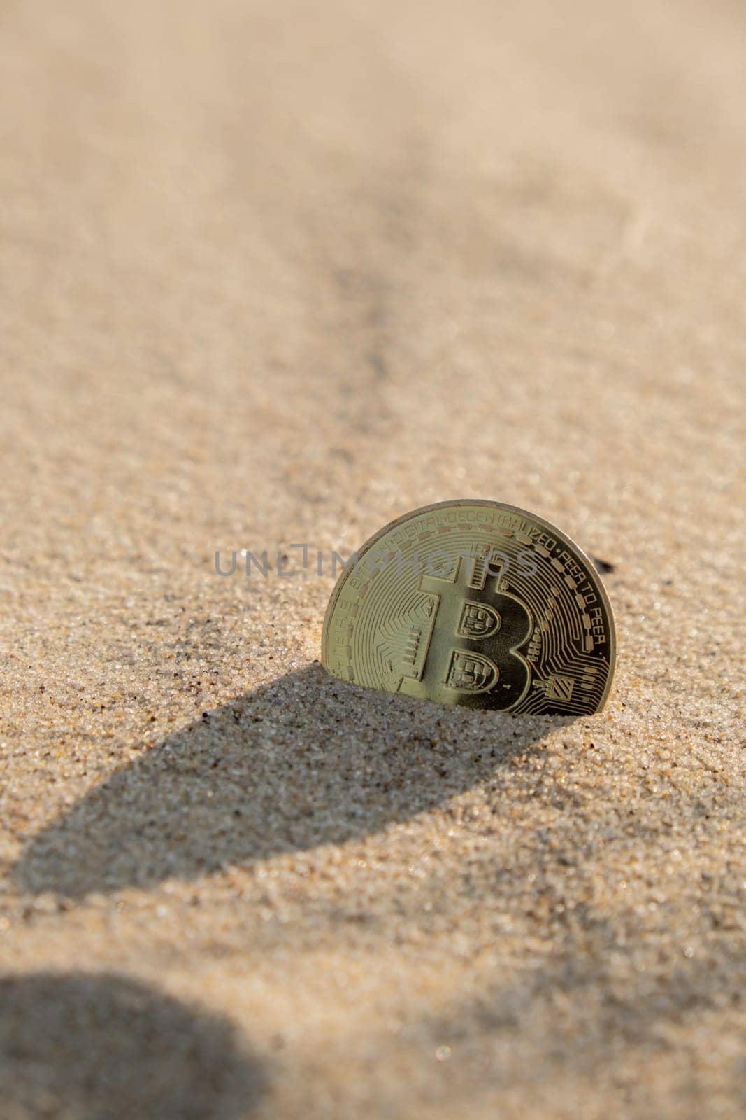 Bitcoin Coin cryptocurrency In Sand On Beach. Freelance, stock exchange BTC sign Concept mining bitcoin for holidays and vacation. Payment For Nature And Unlimited Possibilities. Copy Space Worldwide digital money and stock business