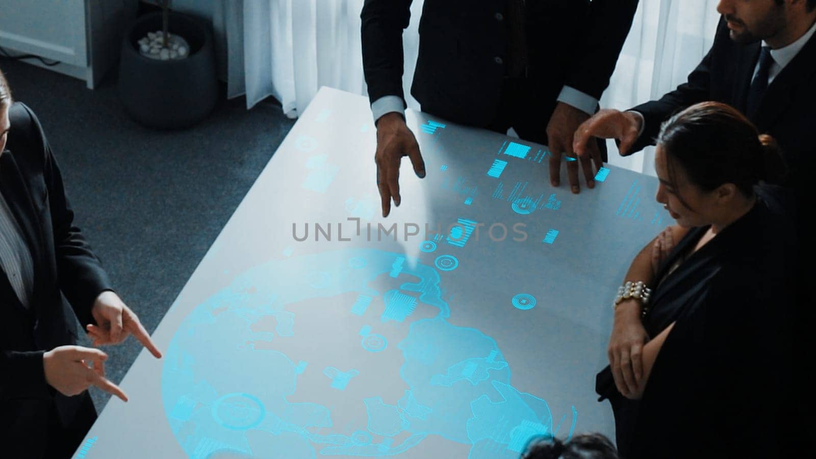 Top view of project manager looking hologram of global networking connection table surrounded by diverse business people brainstorm and planning strategy by using digital communication. Directorate.