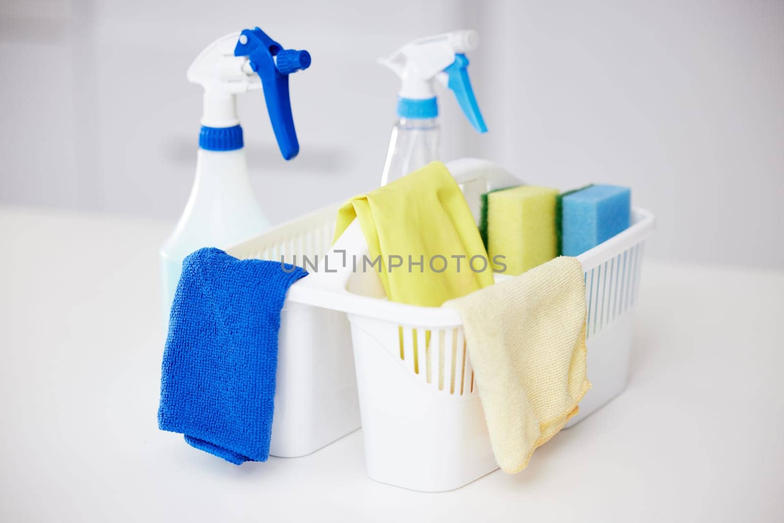 Cleaning, tools and basket with bottle spray for home disinfection or detergent container for janitor service. Chemical, cleaner or washing supplies with cloth and protection from bacteria or germs by YuriArcurs