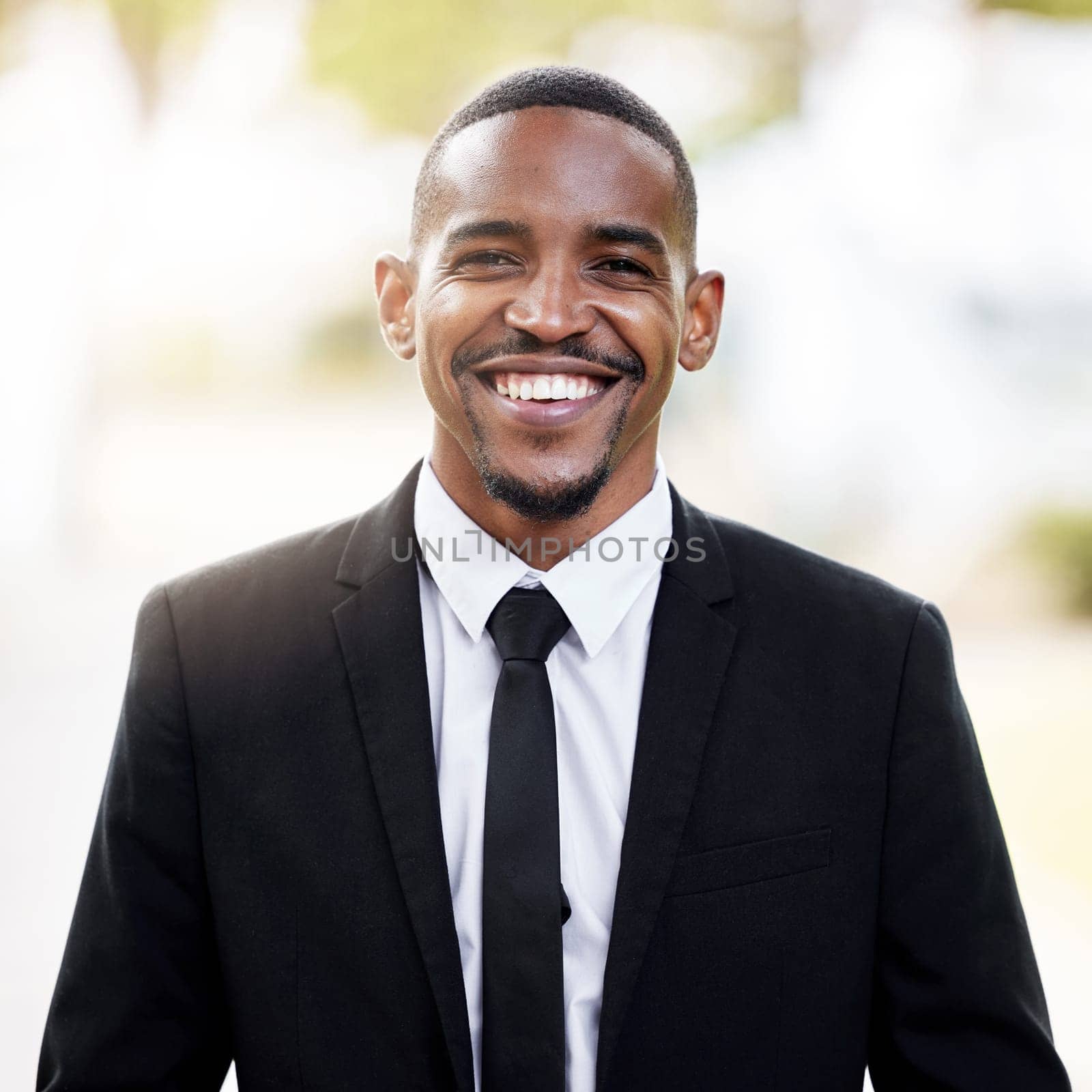 Happy, black man and fashion in portrait with formal suit outdoor with ambition and insight for business. Confident, male model or financial broker with smile and pride outside for morning commute by YuriArcurs