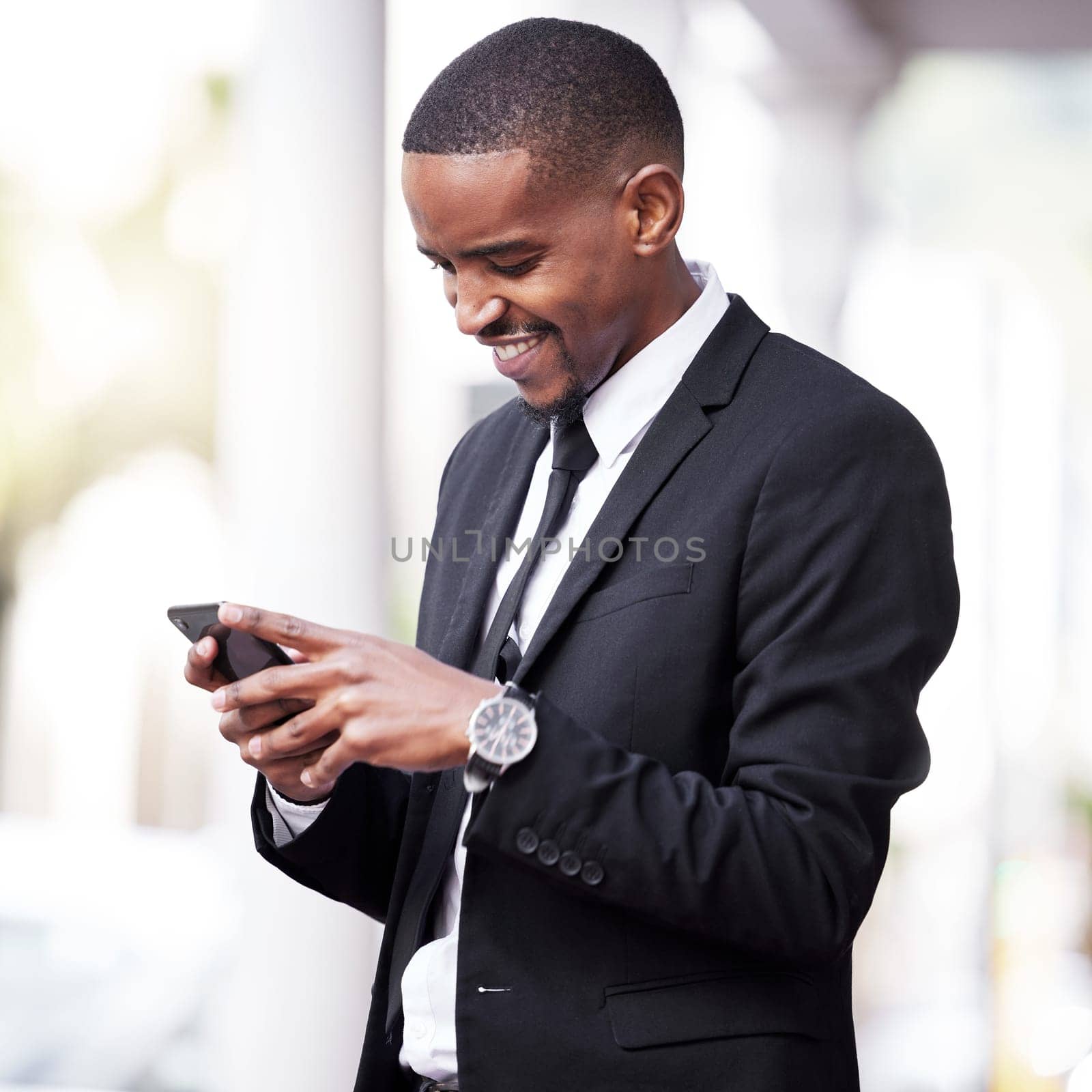 Professional, chat and black man with smartphone in city for networking, communication or social media. Break, smille and lawyer on mobile for browsing web, texting or connection in urban town.
