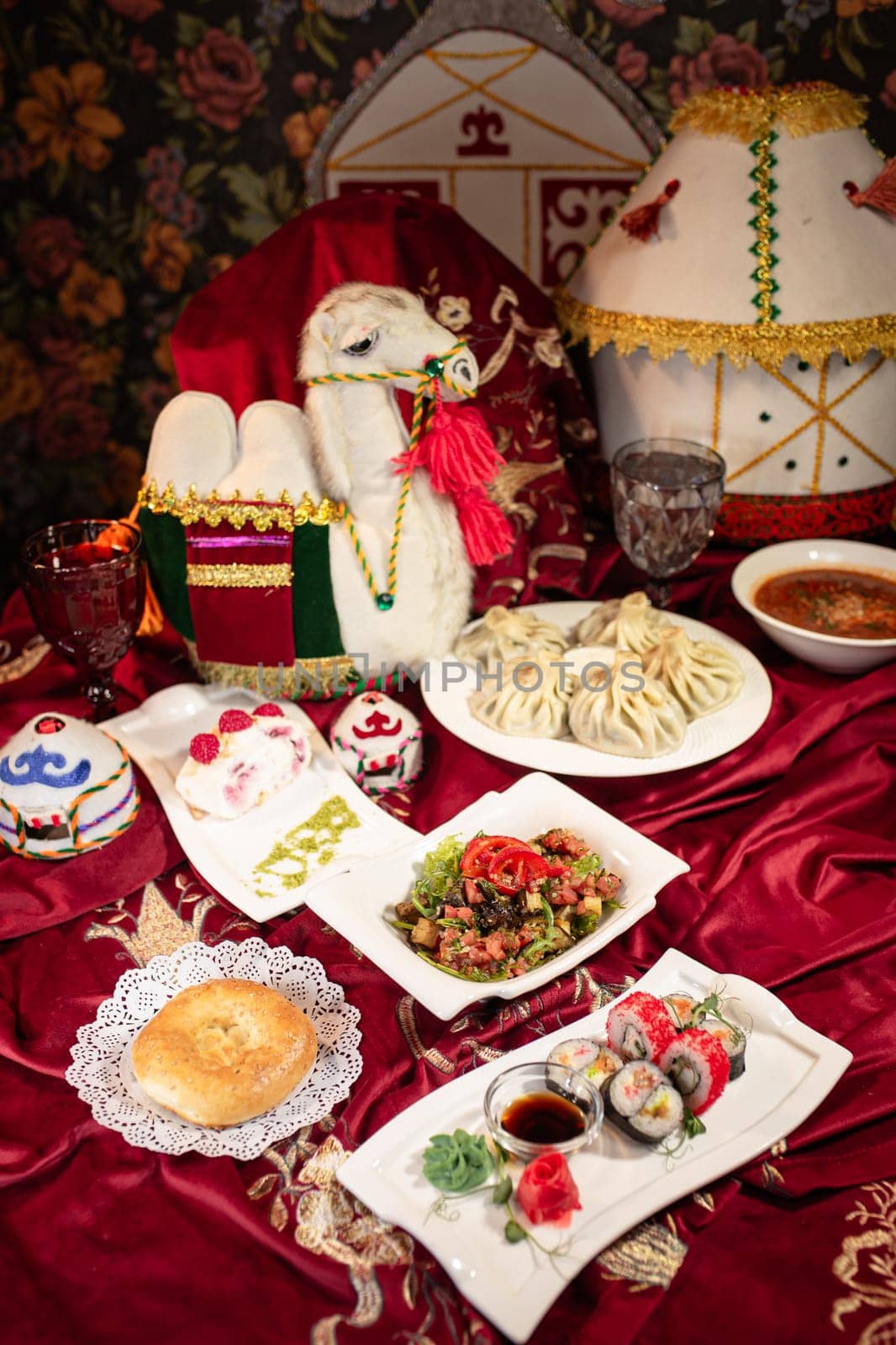 Traditional Kazakh Dastarkhan with Beshbarmak, Manty, Samsa, and Baursak by Pukhovskiy