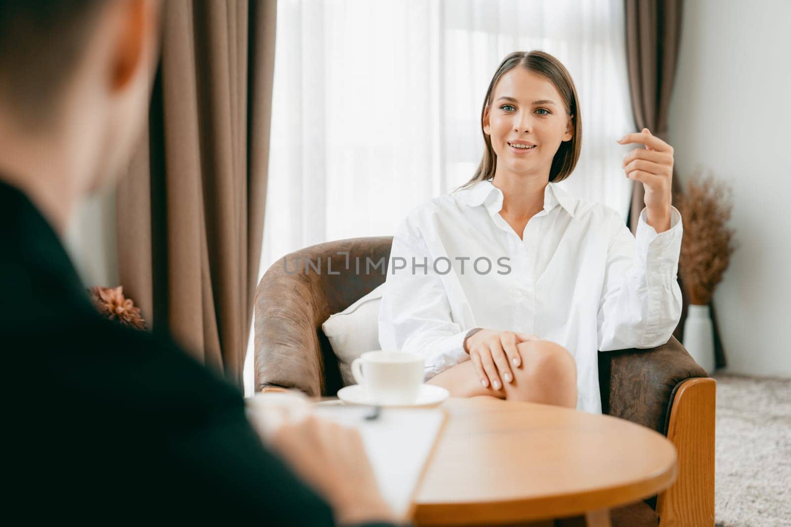 Psychological consultation gaining improvement on mental problem, happy young female patient doing therapy session while psychiatrist making diagnostic on mental illness. Unveiling