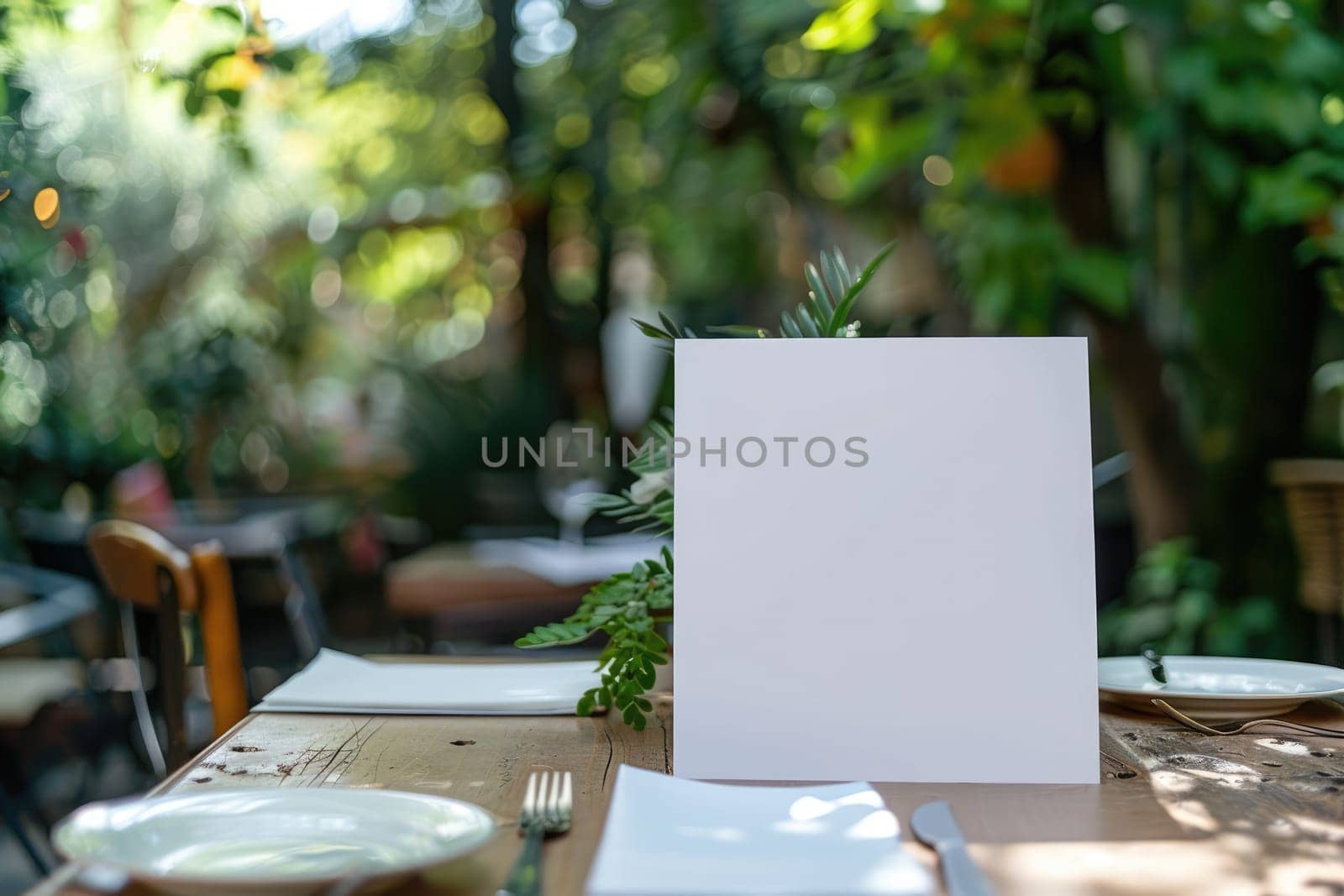 Blank menu or invite standing on wooden table in outdoor garden restaurant setting with natural green background. For food and beverage marketing or design with place for text. Ai generation. Ai