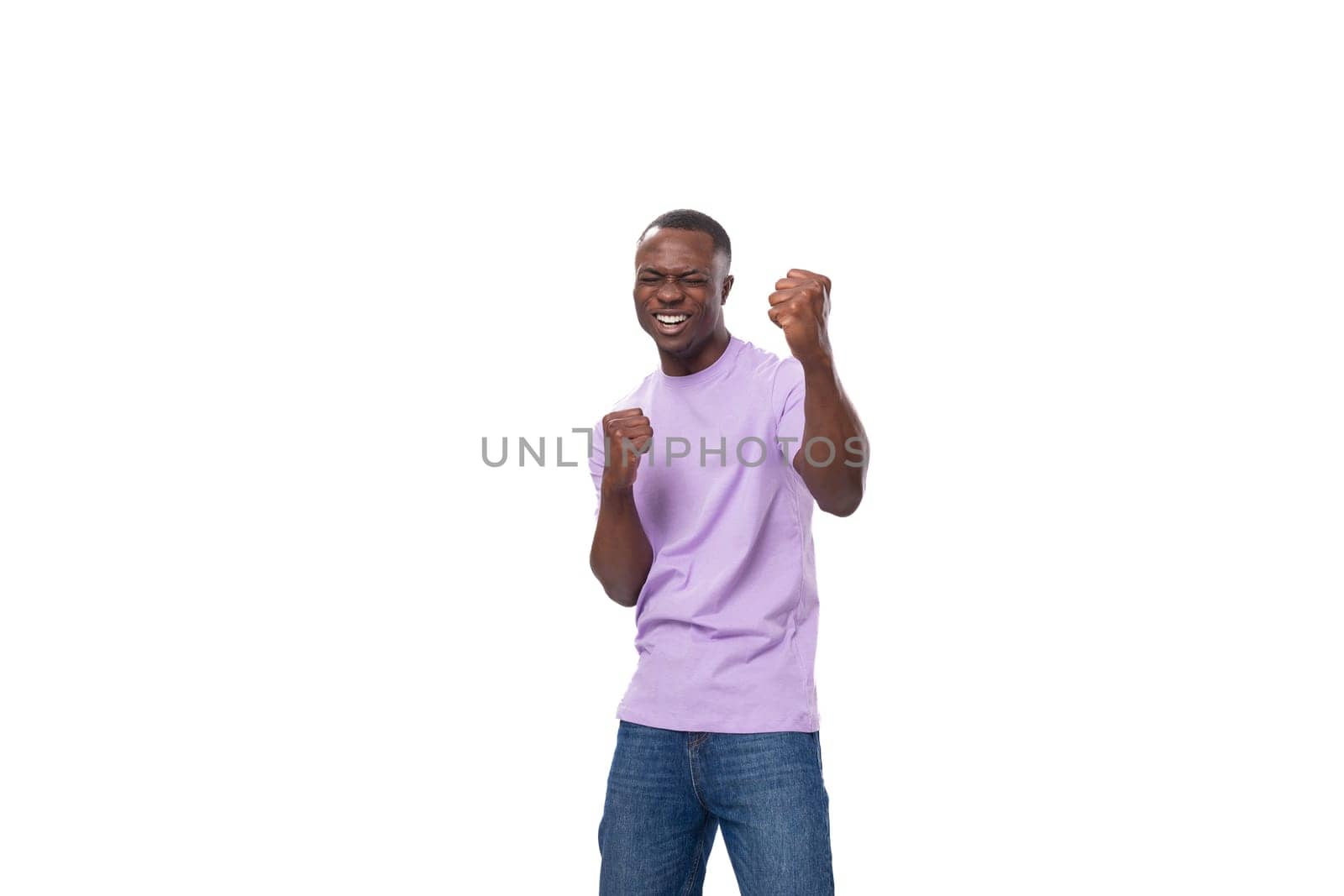 young happy joyful cute african man in lilac t-shirt laughing on white background.