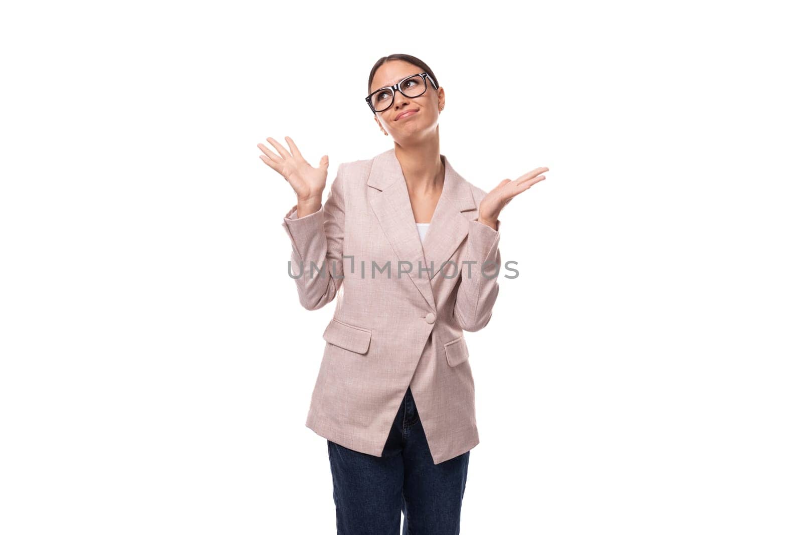 successful pretty 30 year old business woman with black hair wearing a beige jacket on a white background with copy space by TRMK