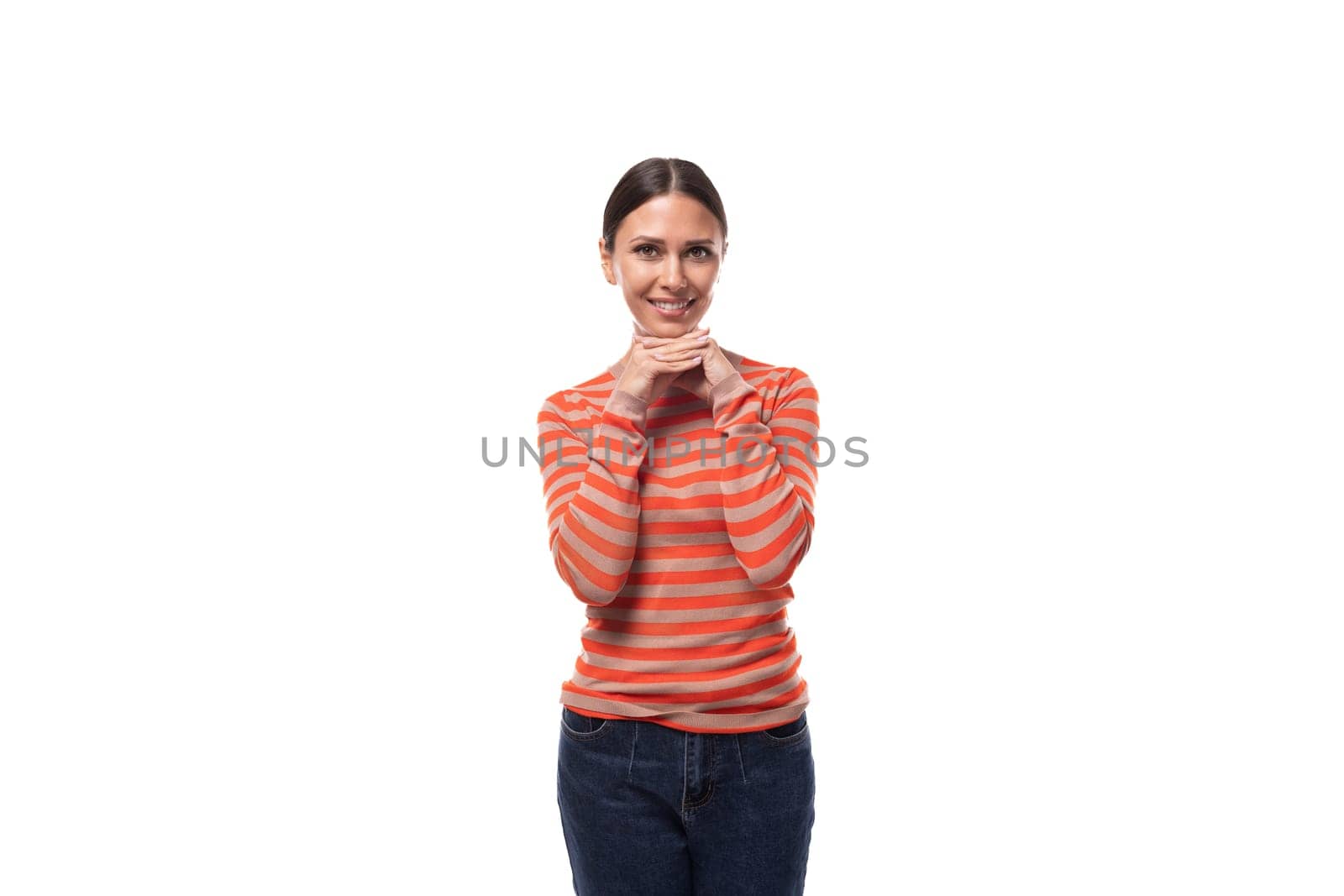 young charming european woman with black hair is wearing an orange turtleneck by TRMK