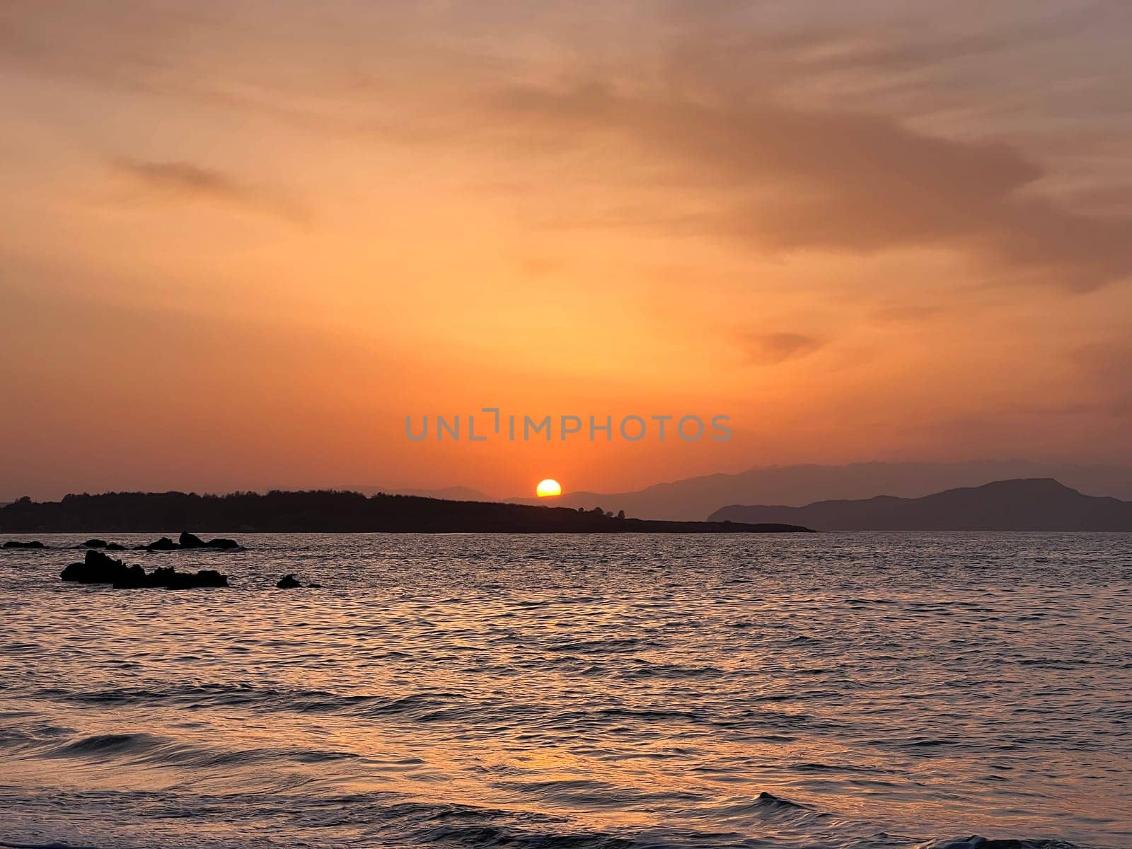 Golden hour sunrise in Chania Crete sun in see romantic. High quality photo
