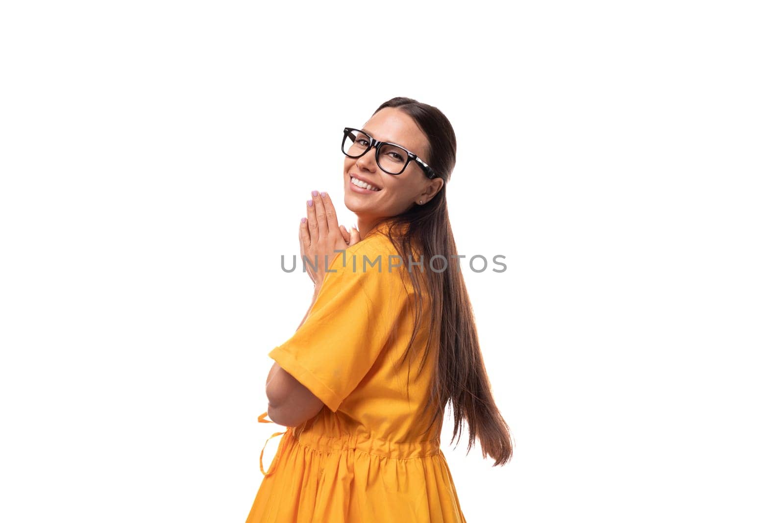 young pretty brunette lady dressed in yellow dress inspired by an idea.