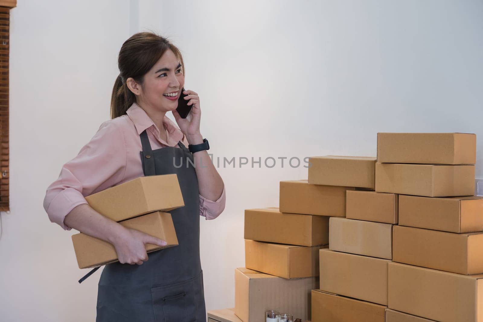Startup small business entrepreneur SME, asian woman receive order on phone. Success young Asian small business owner home office, online sell marketing delivery.