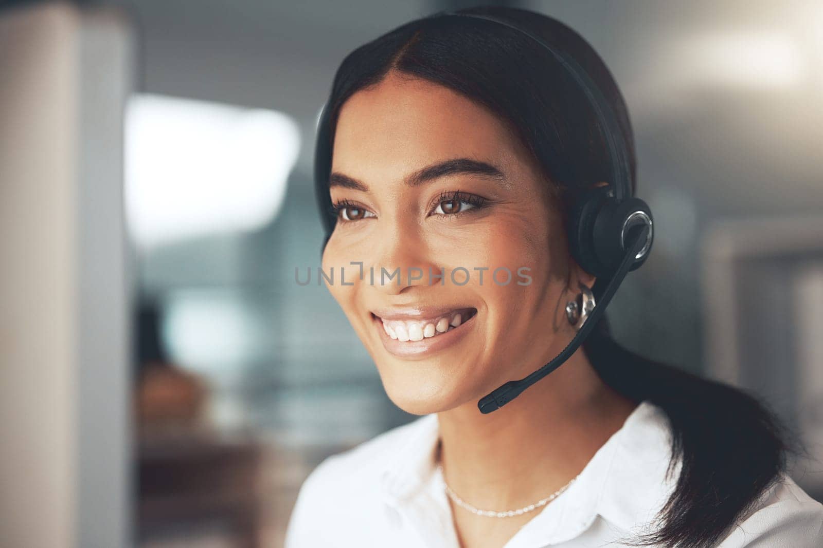 Call center, computer and smile with woman consultant in telemarketing office for help or sales. Contact us, face and headset with happy agent in workplace for online customer service or support.