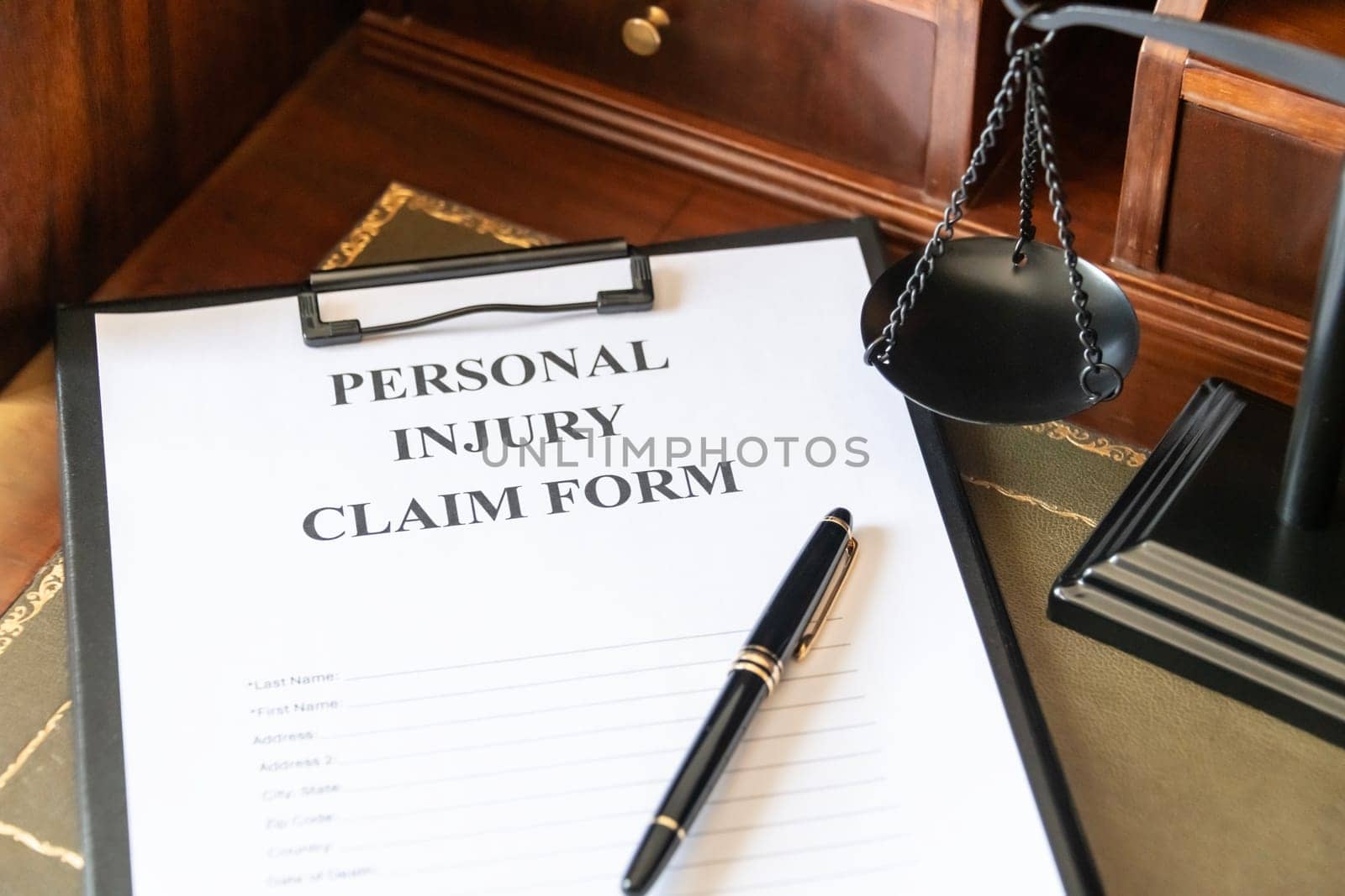 Personal Injury Claim Form on a Lawyer's Desk. by jbruiz78