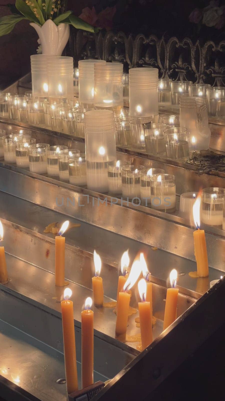 Candles are lit in the Catholic Church. by DovidPro