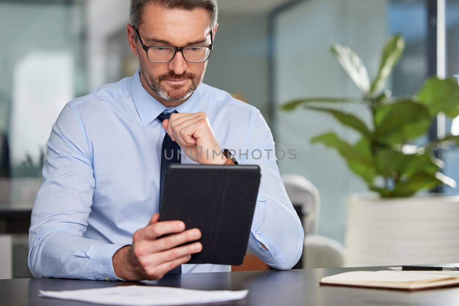 Business, man and tablet in office or thinking for planning, schedule and research for goals of company growth. Male person, digital technology and data with information for project development.