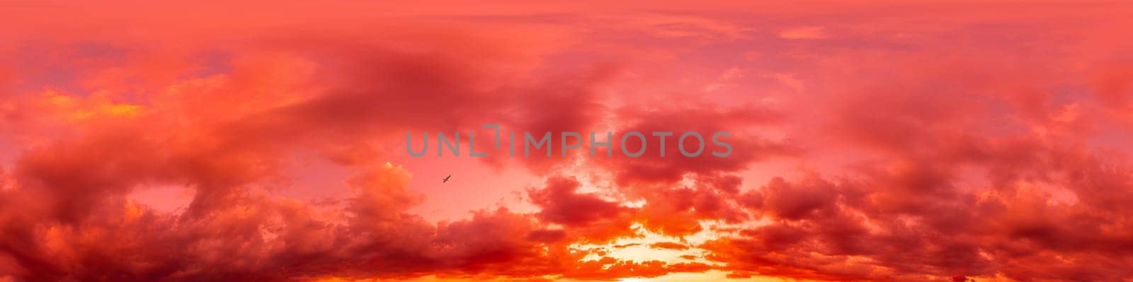 Dramatic Sunset sky 360 panorama. Vibrant sky with bright glowing red pink Cumulus clouds. HDR 360 seamless spherical panorama. Sky dome for aerial drone panoramas. Climate and weather change