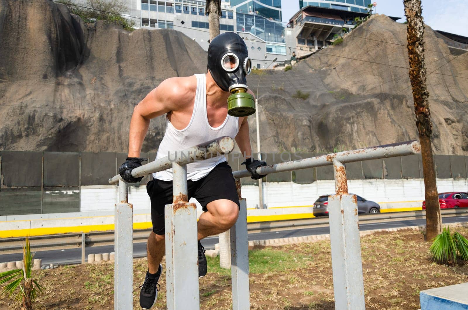 athletic man in a protective mask at practice in the morning. by Peruphotoart
