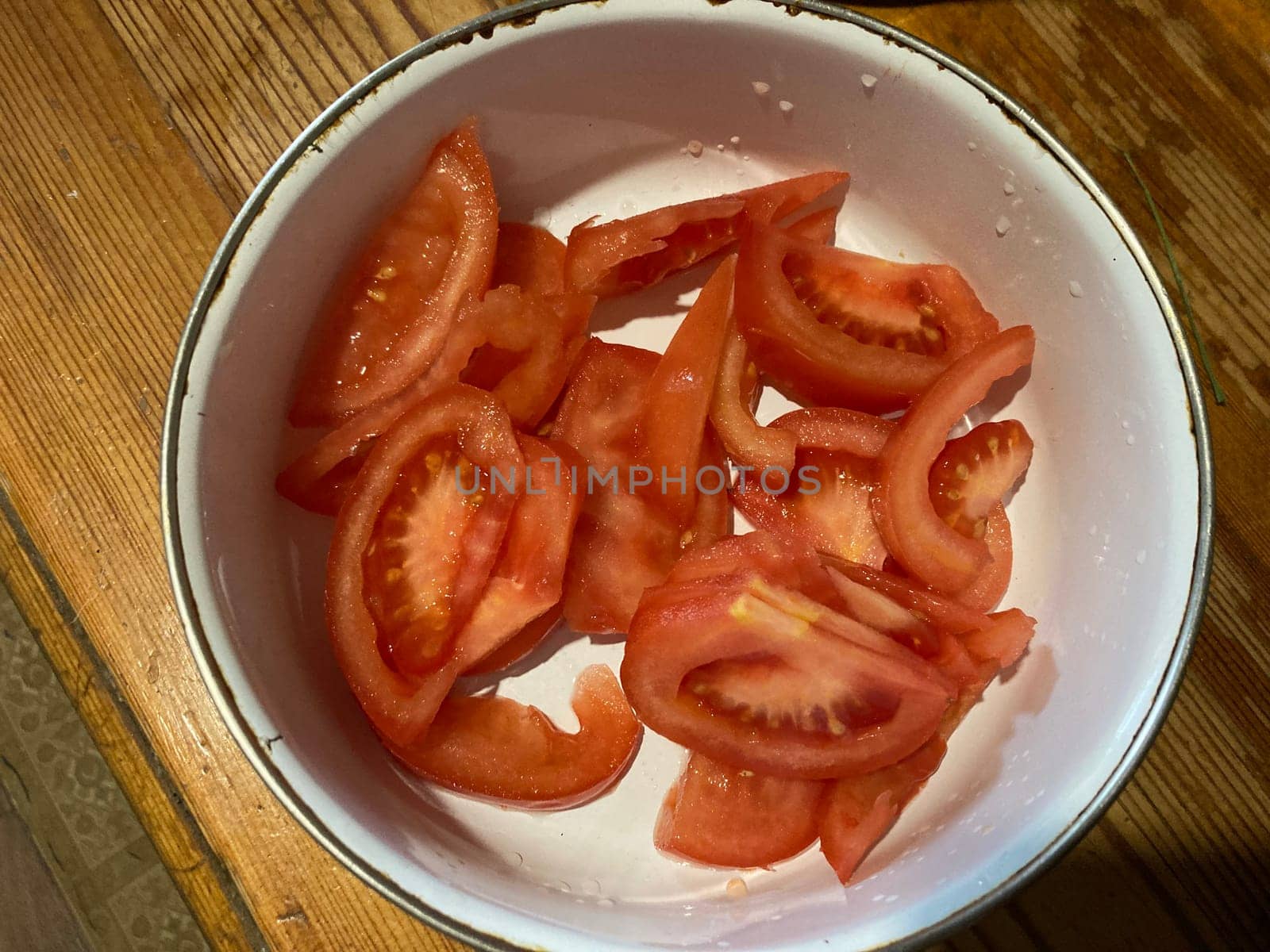 Red tomatoes chopped in a the  bowl