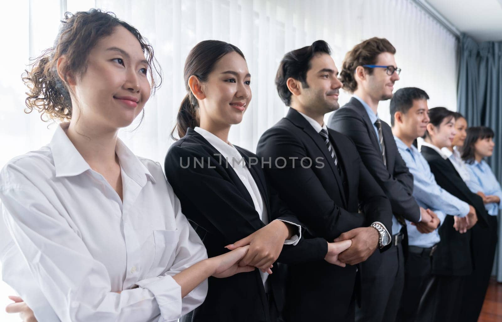 Modern diversity and multicultural company, business people joining hand together and standing in line, shared commitment to collaboration and cooperation concept background. Meticulous