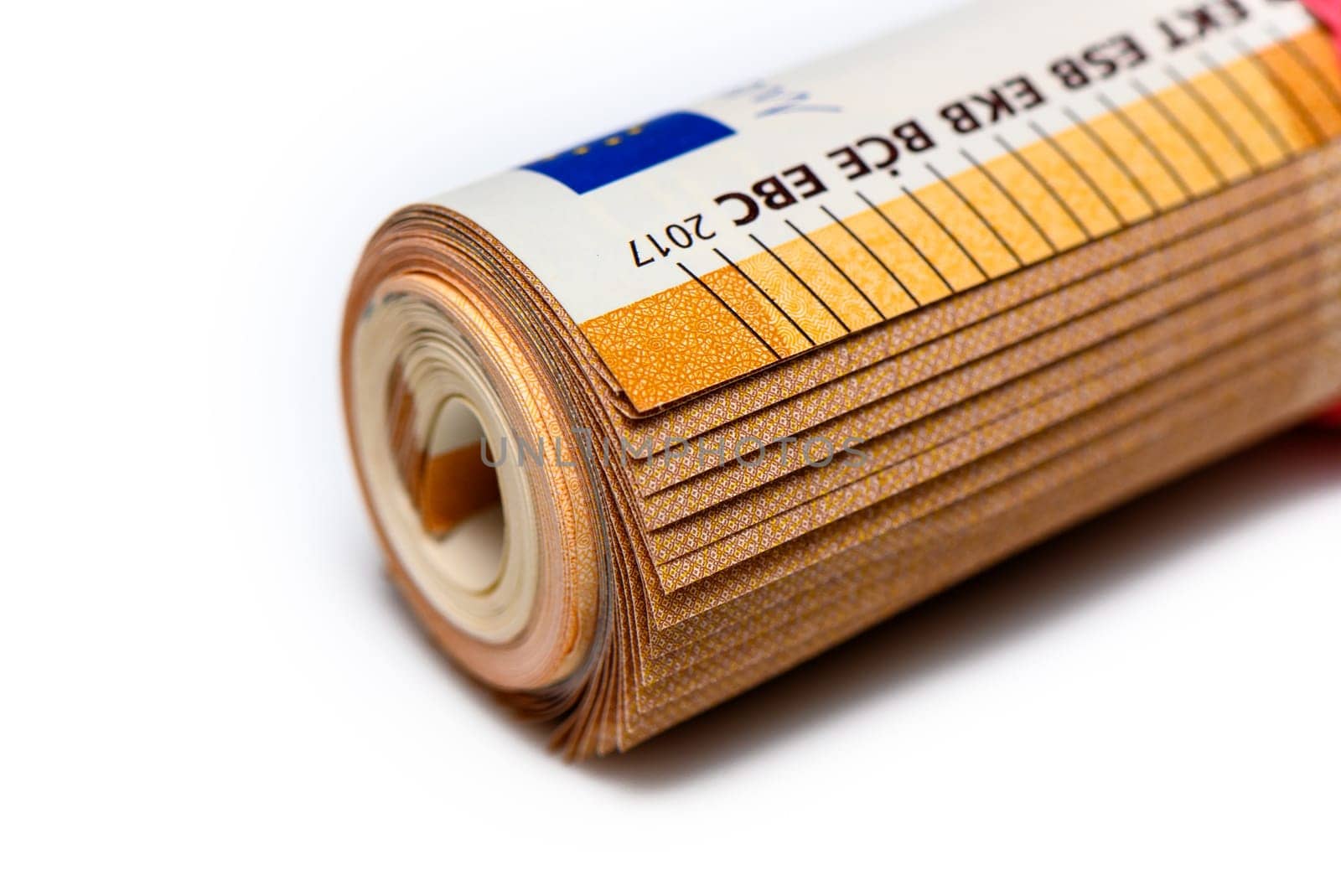 Close-up of a bundle of fifty euro bank notes bound with rubber band