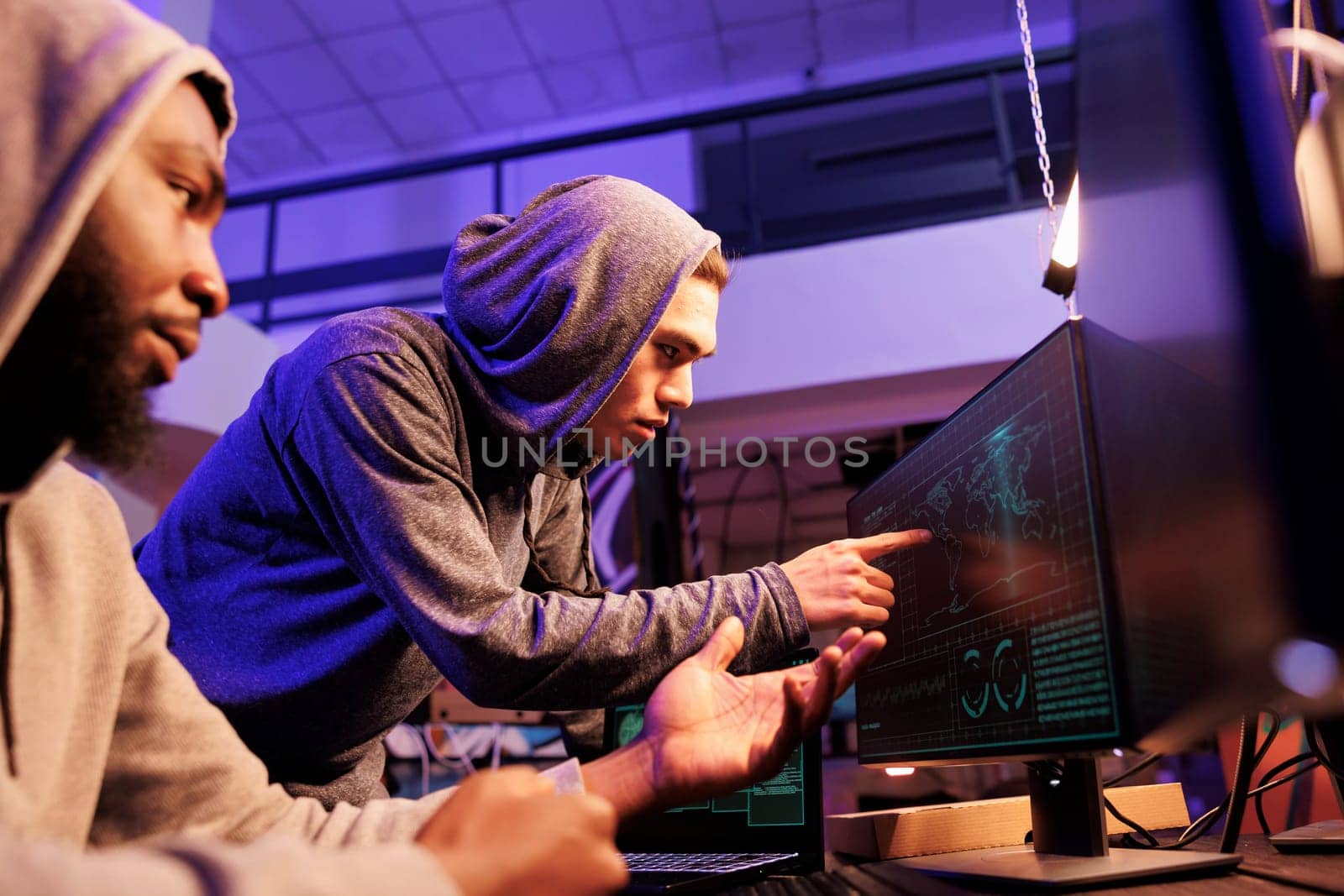 Hackers pointing at screen while spying by DCStudio