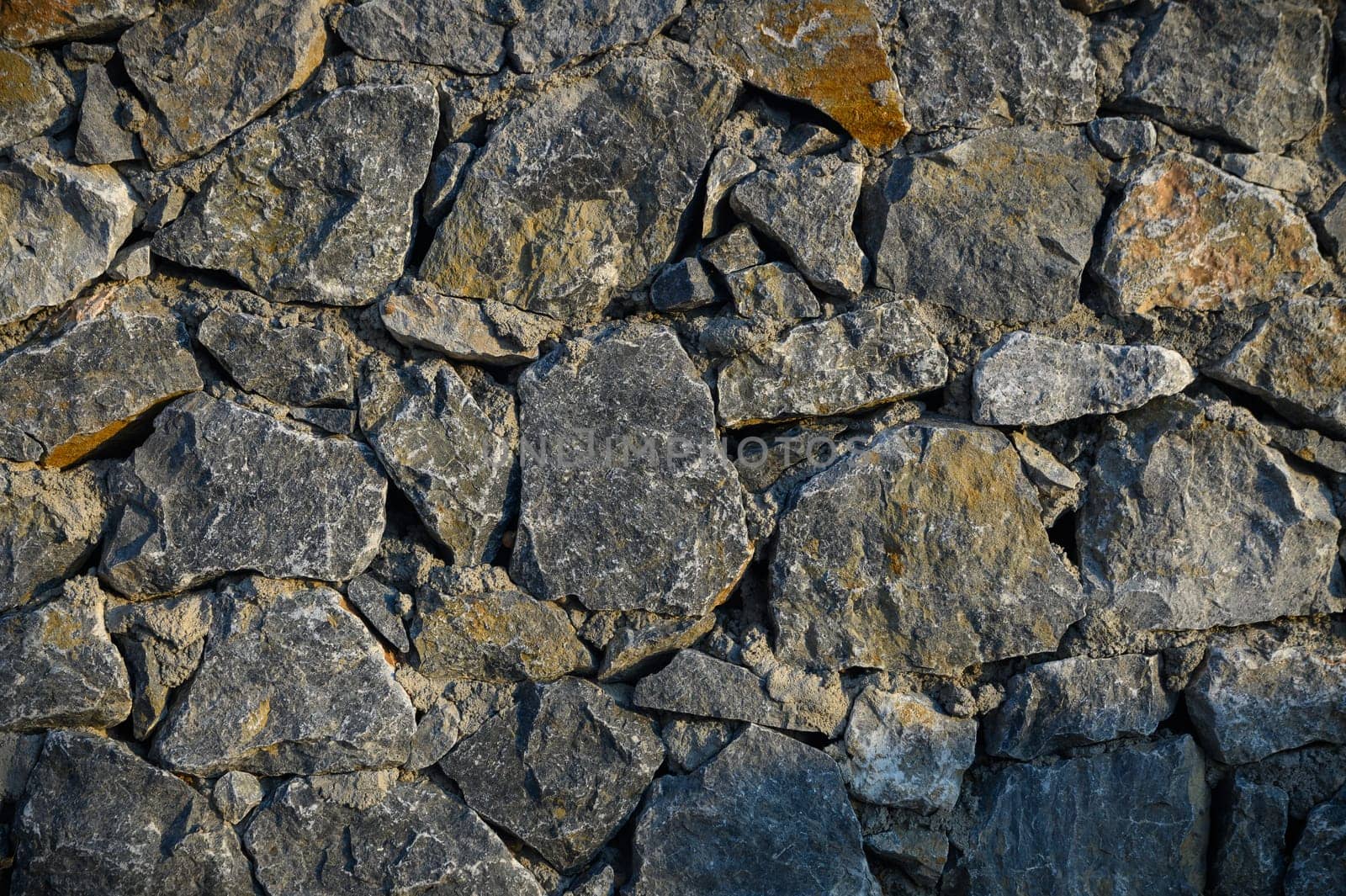 Wall with various size and shaped stones 4